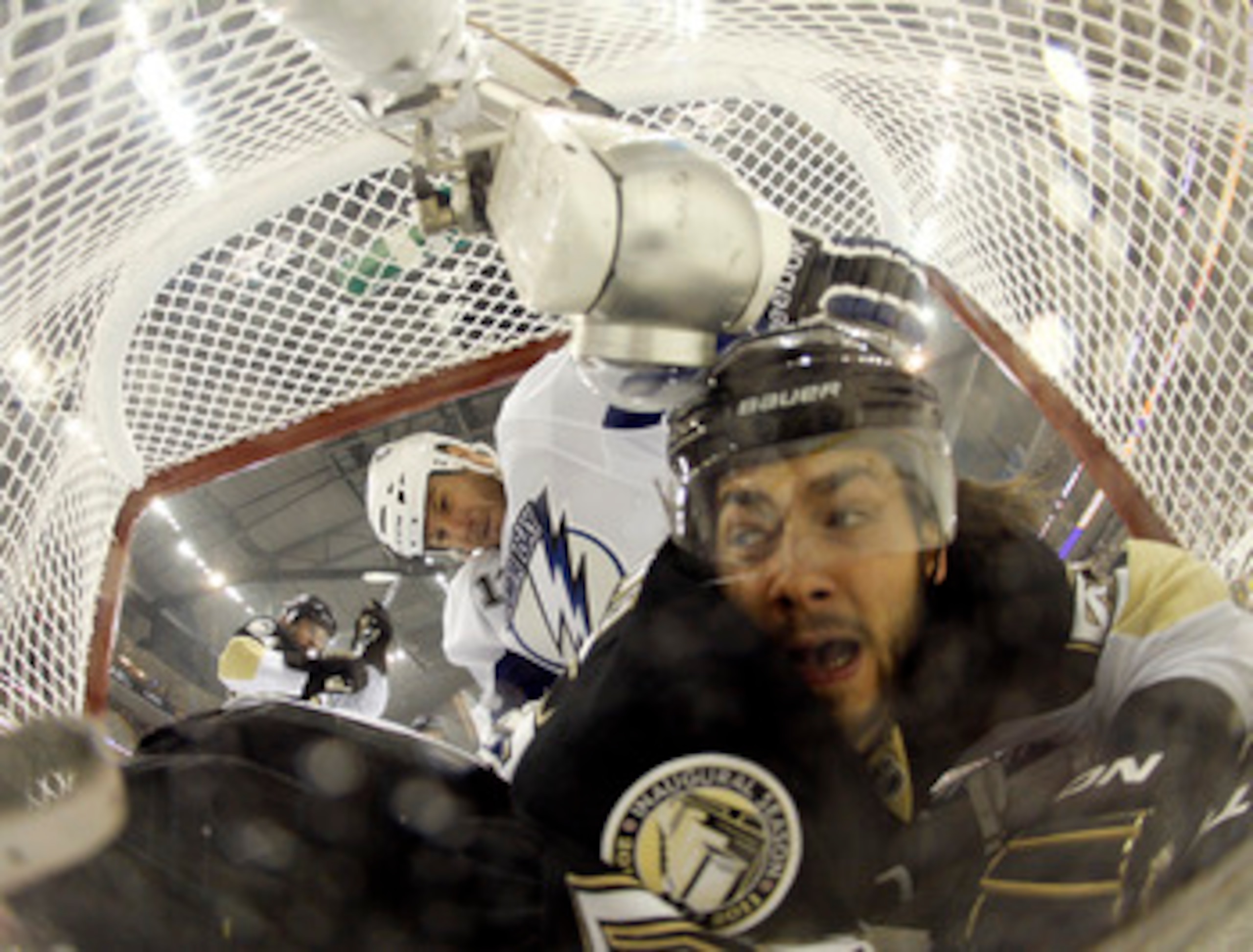 PITTSBURGH, PA - APRIL 27:  Kris Letang #58 of the Pittsburgh Penguins and Pavel Kubina #13 of the Tampa Bay Lightning crash the net in Game Seven of the Eastern Conference Quarterfinals during the 2011 NHL Stanley Cup Playoffs at Consol Energy Center on