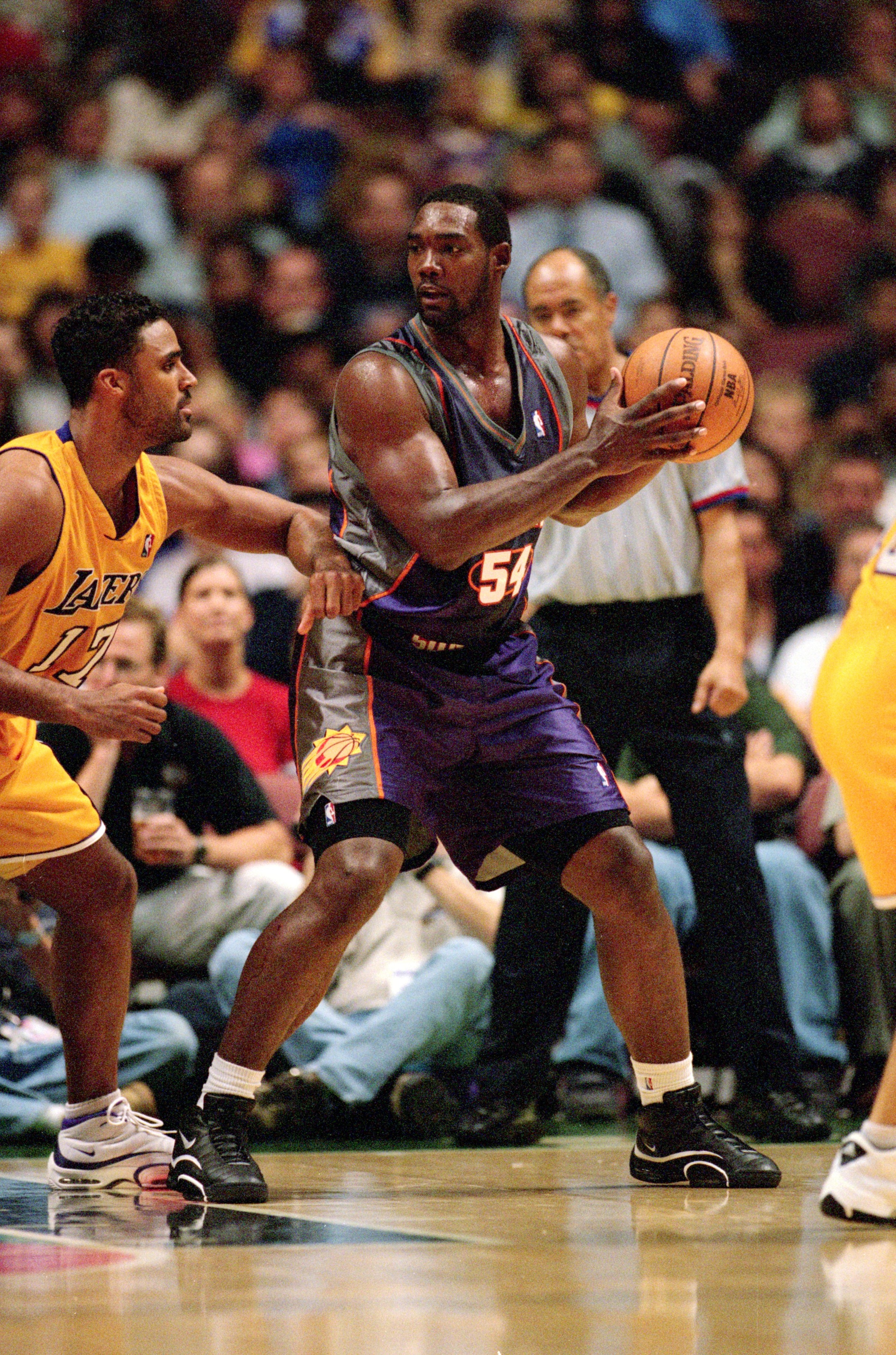 18 Oct 2000:  Rodney Rogers #54 of the Phoenix Suns looks to pass the ball during the Pre-Season Game against the Los Angeles Lakers at the Arrowhead Pond in Anaheim, California. The Suns defeated the Lakers 86-78. NOTE TO USER: It is expressly understood