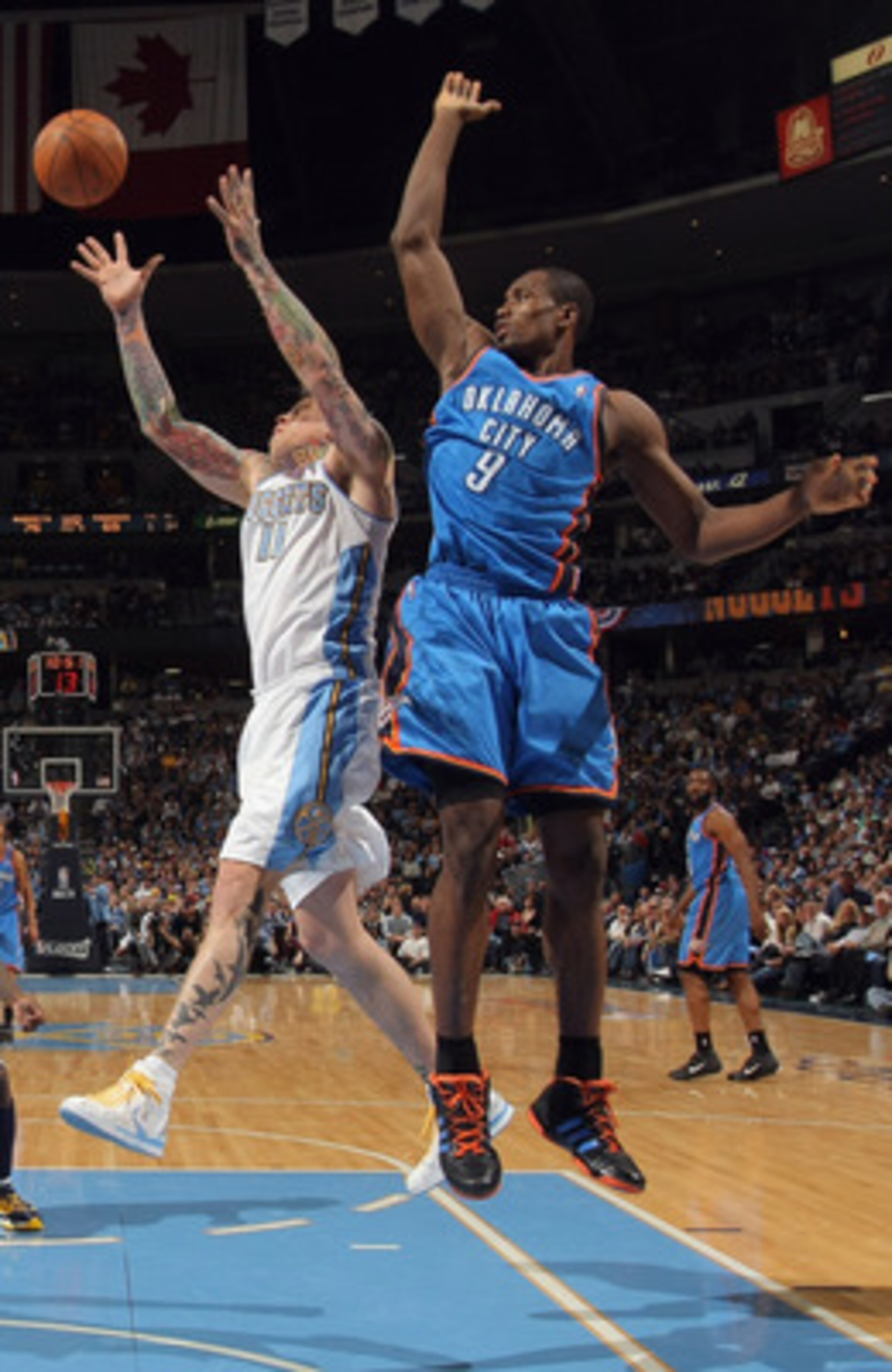 DENVER, CO - APRIL 25:  Chris Andersen #11 of the Denver Nuggets grabs a rebound away from Serge Ibaka #9 of the Oklahoma City Thunder in Game Four of the Western Conference Quarterfinals in the 2011 NBA Playoffs on April 24, 2011 at the Pepsi Center in D