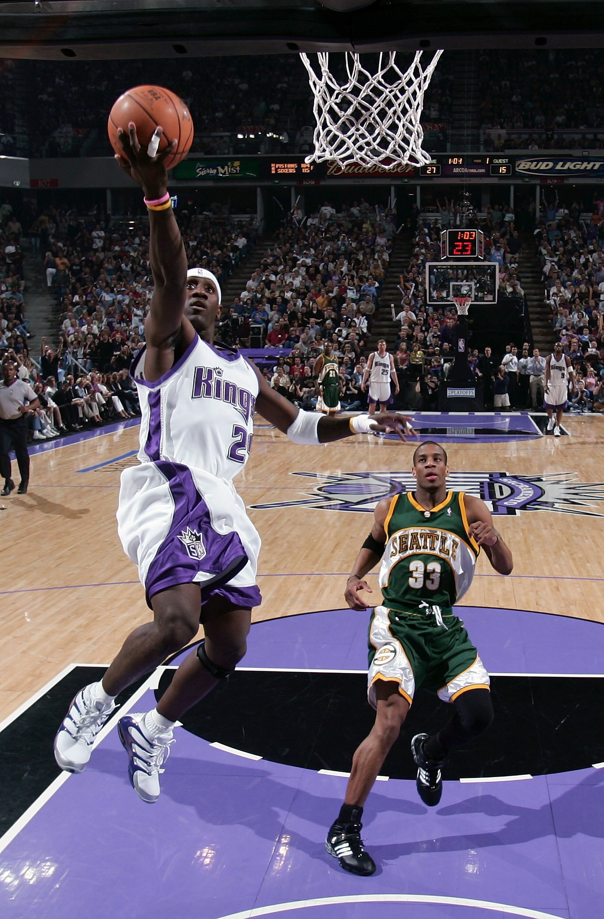 SACRAMENTO, CA  - APRIL 29:  Bobby Jackson #24 of the Sacramento Kingsbattle shoots over Antonio Daniels #33 of the Seattle SuperSonics in Game three of the Western Conference First Round during the 2005 NBA Playoffs on April 29, 2005 at Arco Arena in Sac