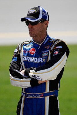 TALLADEGA, AL - APRIL 16:  Kevin Harvick, driver of the #4 Armour Vienna Sausage Chevrolet, stands on the grid prior to the start of the NASCAR Nationwide Series Aaron's 312 at Talladega Superspeedway on April 16, 2011 in Talladega, Alabama.  (Photo by Ch