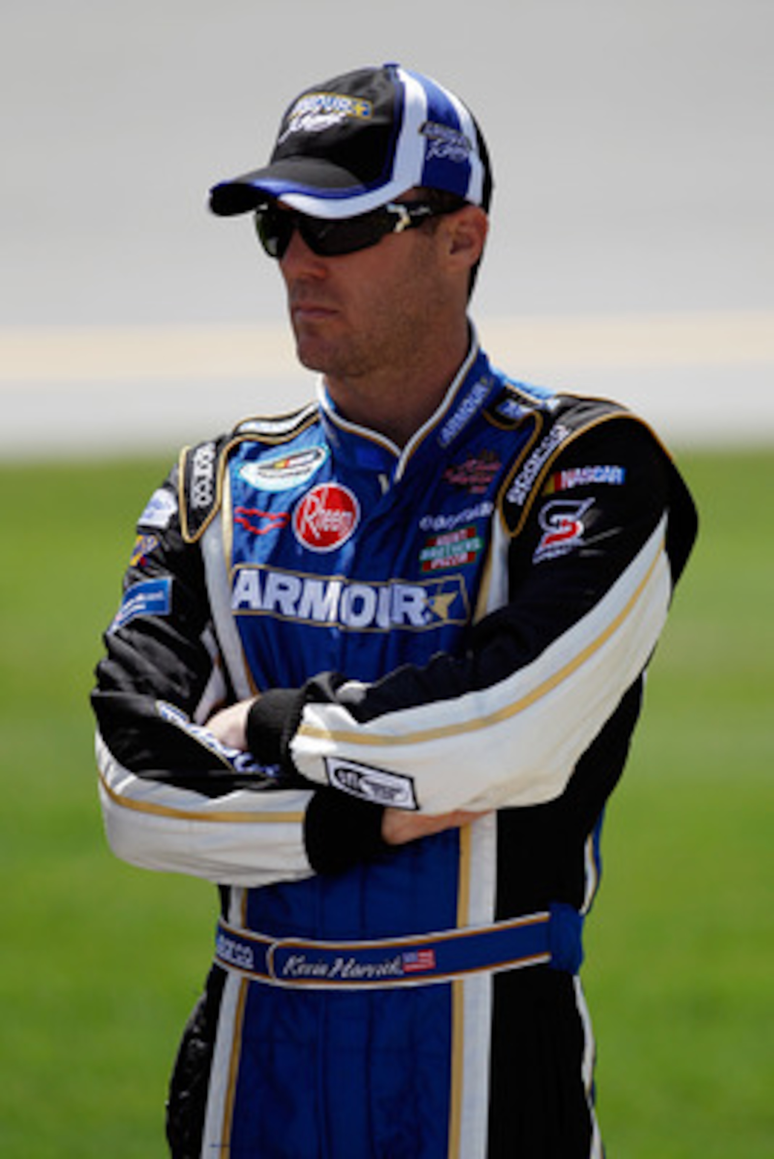 TALLADEGA, AL - APRIL 16:  Kevin Harvick, driver of the #4 Armour Vienna Sausage Chevrolet, stands on the grid prior to the start of the NASCAR Nationwide Series Aaron's 312 at Talladega Superspeedway on April 16, 2011 in Talladega, Alabama.  (Photo by Ch