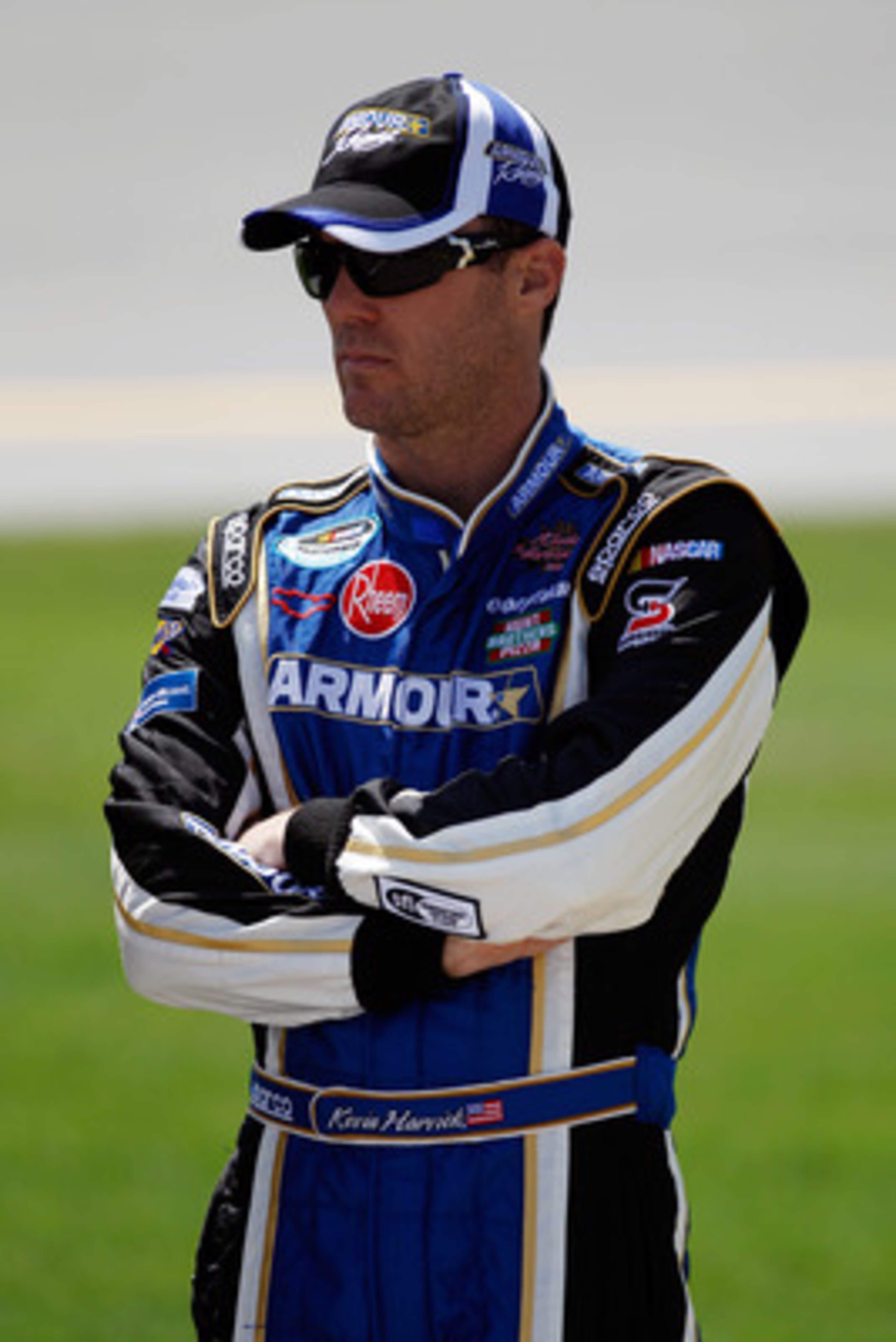 TALLADEGA, AL - APRIL 16:  Kevin Harvick, driver of the #4 Armour Vienna Sausage Chevrolet, stands on the grid prior to the start of the NASCAR Nationwide Series Aaron's 312 at Talladega Superspeedway on April 16, 2011 in Talladega, Alabama.  (Photo by Ch