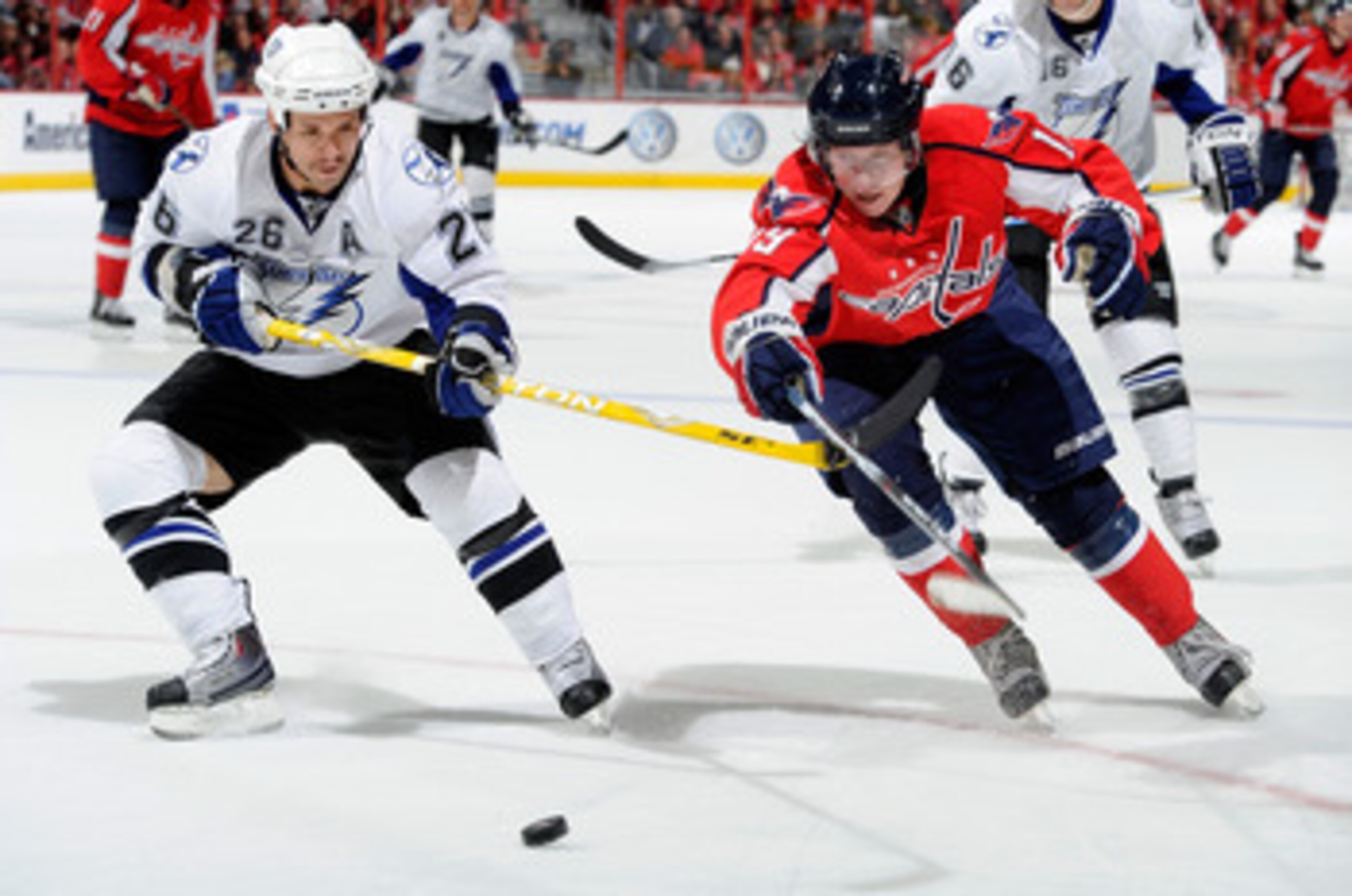 WASHINGTON - NOVEMBER 26:  Nicklas Backstrom #19 of the Washington Capitals battles for the puck with Martin St Louis #26 of the Tampa Bay Lightning at the Verizon Center on November 26, 2010 in Washington, DC.  (Photo by Greg Fiume/Getty Images)