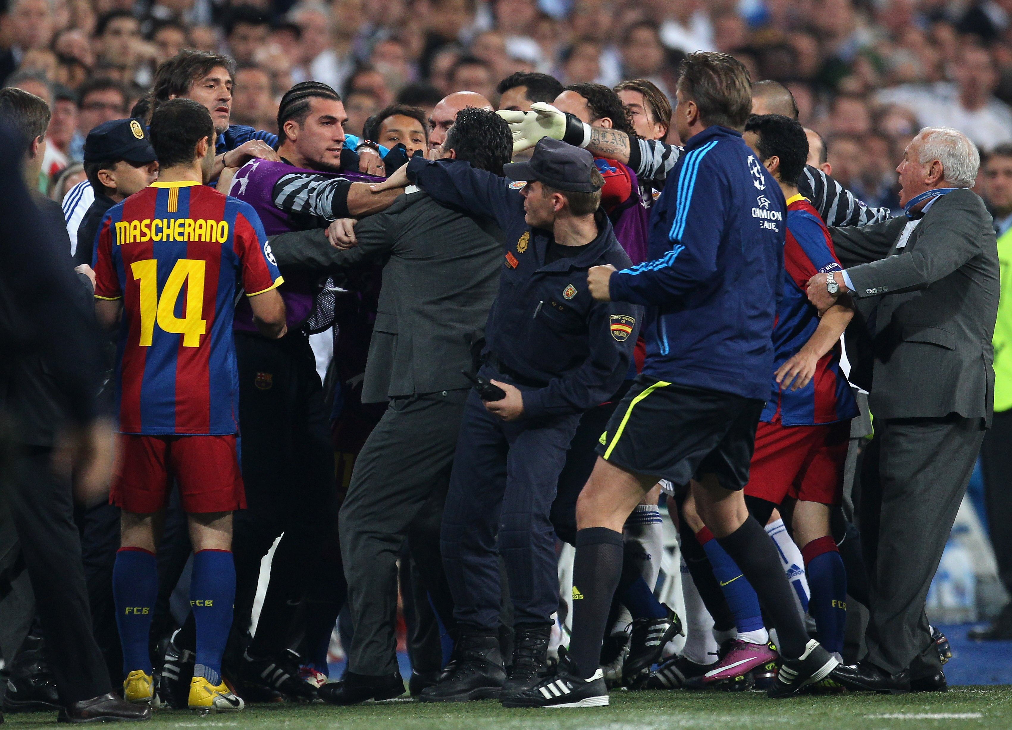 MADRID, SPAIN - APRIL 27:  Jose Pinto of Barcelona clashes with Real Madrid official as the players leave the pitch at half time during the UEFA Champions League Semi Final first leg match between Real Madrid and Barcelona at Estadio Santiago Bernabeu on