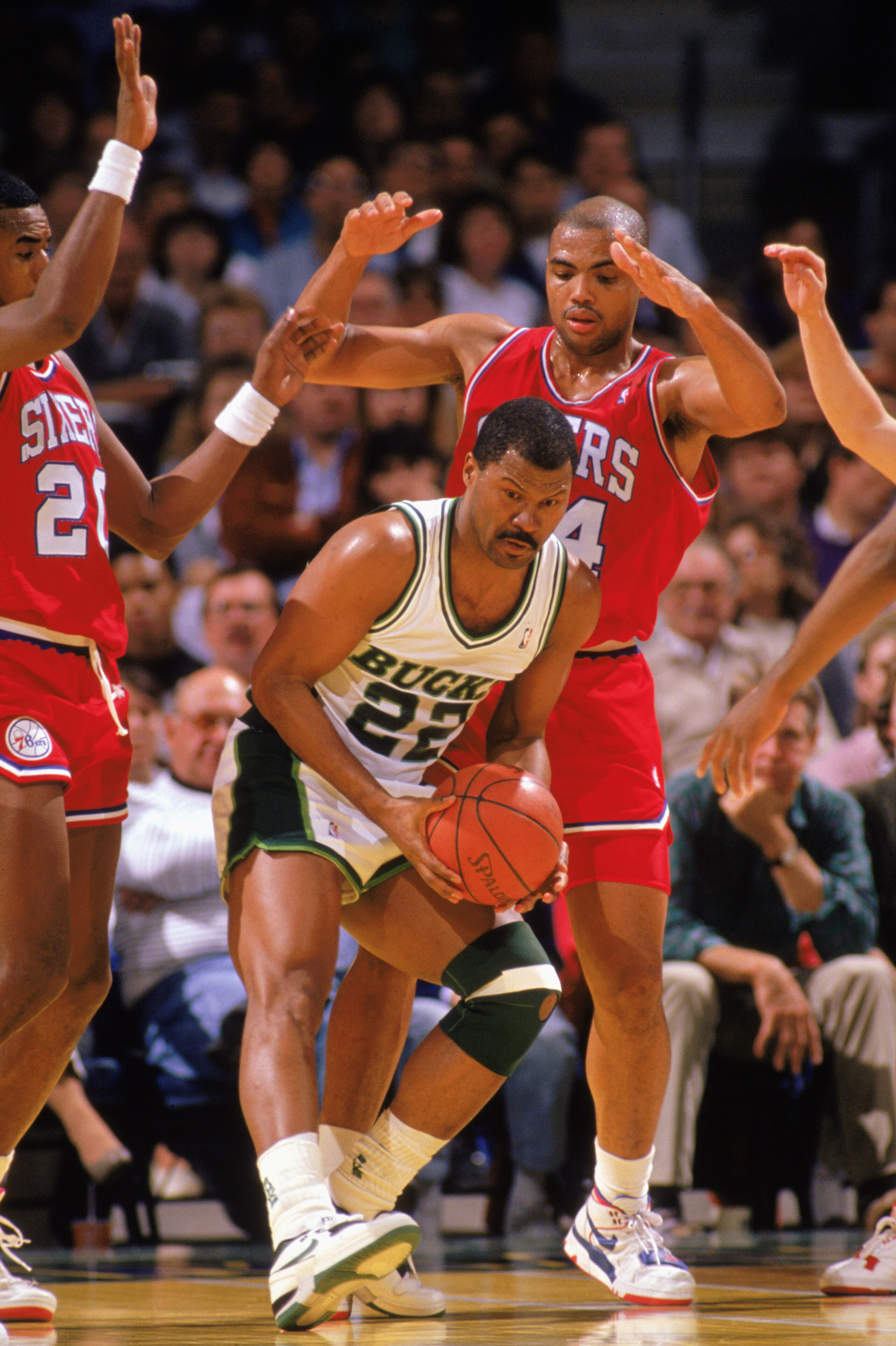 MILWAUKEE - 1989:  Ricky Pierce #22 of the Milwaukee Bucks is defended by Charles Barkley #34 of the Philadelphia 76ers during the 1988-1989 NBA season at the Bradley Center in Milwaukee, Wisconsin. (Photo by Jonathan Daniel/Getty Images)