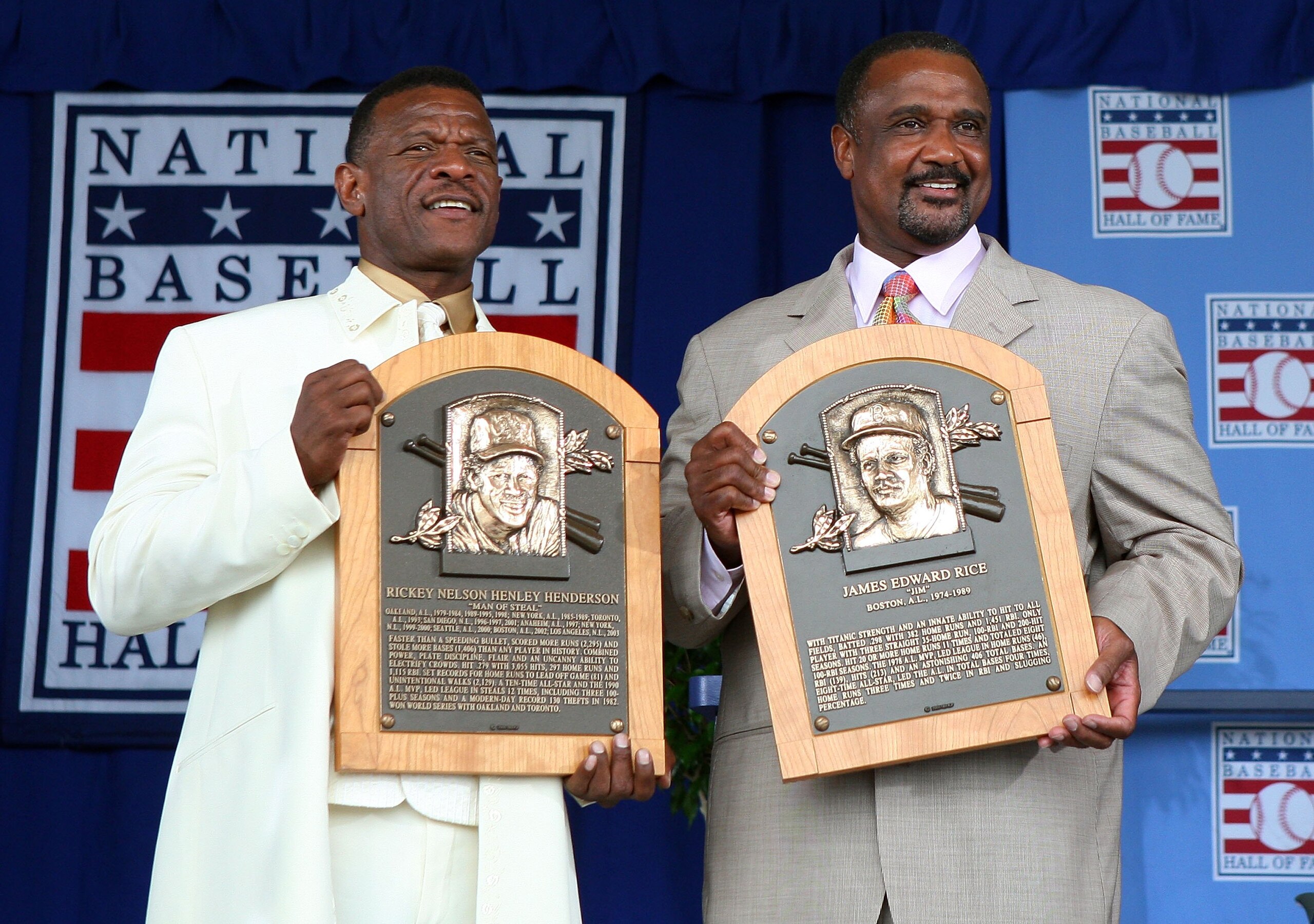 COOPERSTOWN, NY - JULY 26:  2009 inductees Rickey Henderson (L) and Jim Rice pose for a photograph with their plaques at Clark Sports Center during the Baseball Hall of Fame induction ceremony on July 26, 2009 in Cooperstown, New York. Henderson is the al