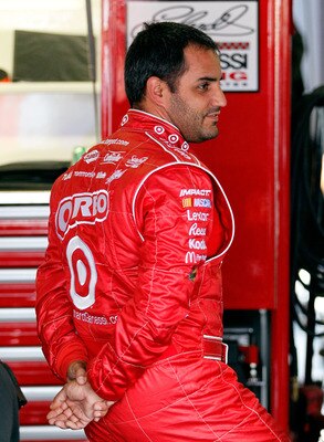 TALLADEGA, AL - APRIL 15:  Juan Pablo Montoya, driver of the #42 Target Chevrolet, stands in the garage during practice for the NASCAR Sprint Cup Series Aaron's 499 at Talladega Superspeedway on April 15, 2011 in Talladega, Alabama.  (Photo by Kevin C. Co