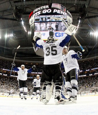 PITTSBURGH, PA - APRIL 27:  Dwayne Roloson #35 of the Tampa Bay Lightning celebrates the win over the Pittsburgh Penguins with Victor Hedman #77 after Game Seven of the Eastern Conference Quarterfinals during the 2011 NHL Stanley Cup Playoffs at Consol En