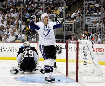 PITTSBURGH, PA - APRIL 23:  Vincent Lecavalier #4 of the Tampa Bay Lightning celebrates his second period goal against the Pittsburgh Penguins in Game Five of the Eastern Conference Quarterfinals during the 2011 NHL Stanley Cup Playoffs at Consol Energy C