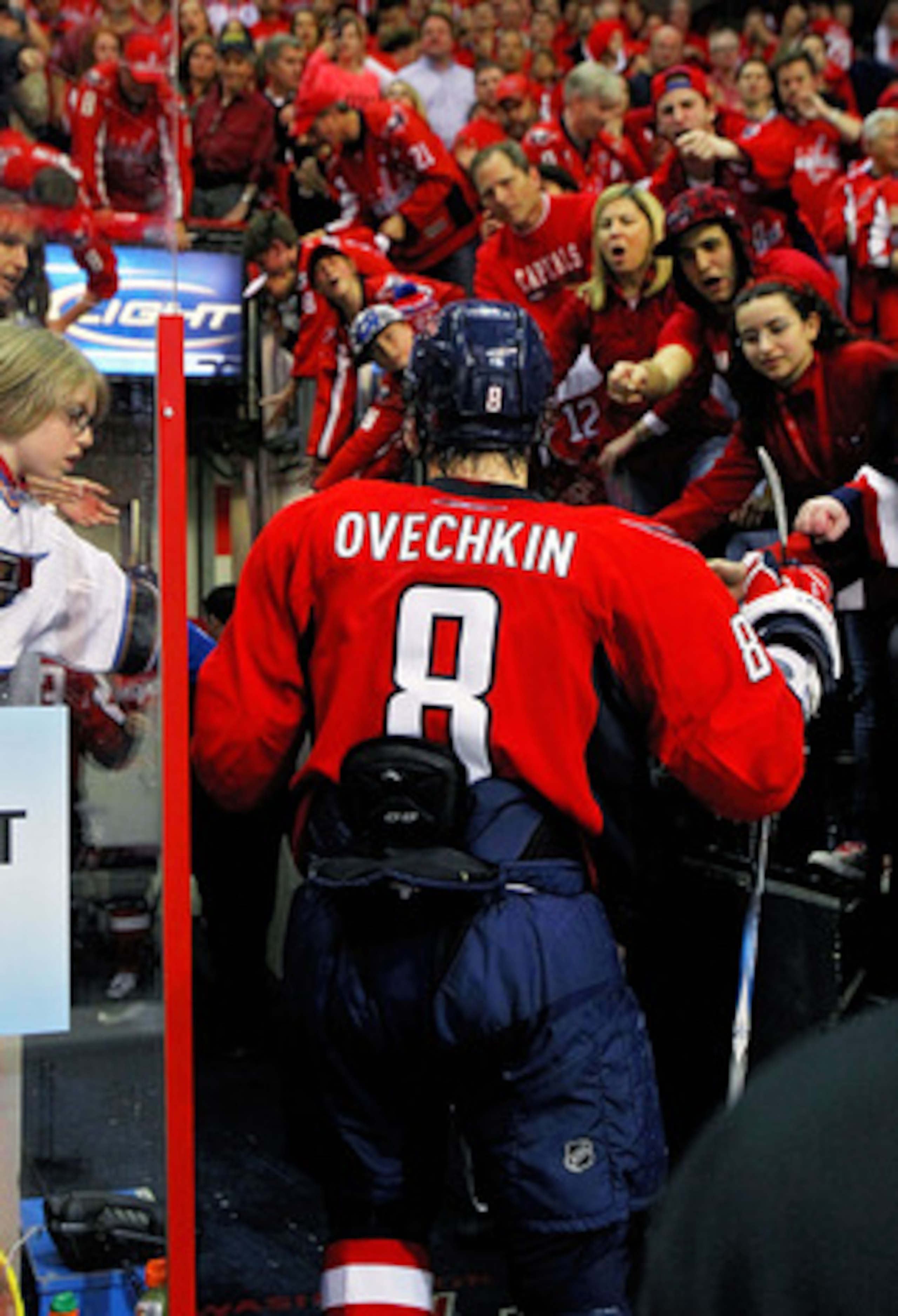 WASHINGTON , DC - APRIL 23: Alex Ovechkin #8 of the Washington Capitals walks though the fans following a 3-1 win over the New York Rangers in Game Five of the Eastern Conference Quarterfinals during the 2011 NHL Stanley Cup Playoffs at the Verizon Cente WASHINGTON , DC - APRIL 23: Alex Ovechkin #8 of the Washington Capitals walks though the fans following a 3-1 win over the New York Rangers in Game Five of the Eastern Conference Quarterfinals during the 2011 NHL Stanley Cup Playoffs at the Verizon Cente