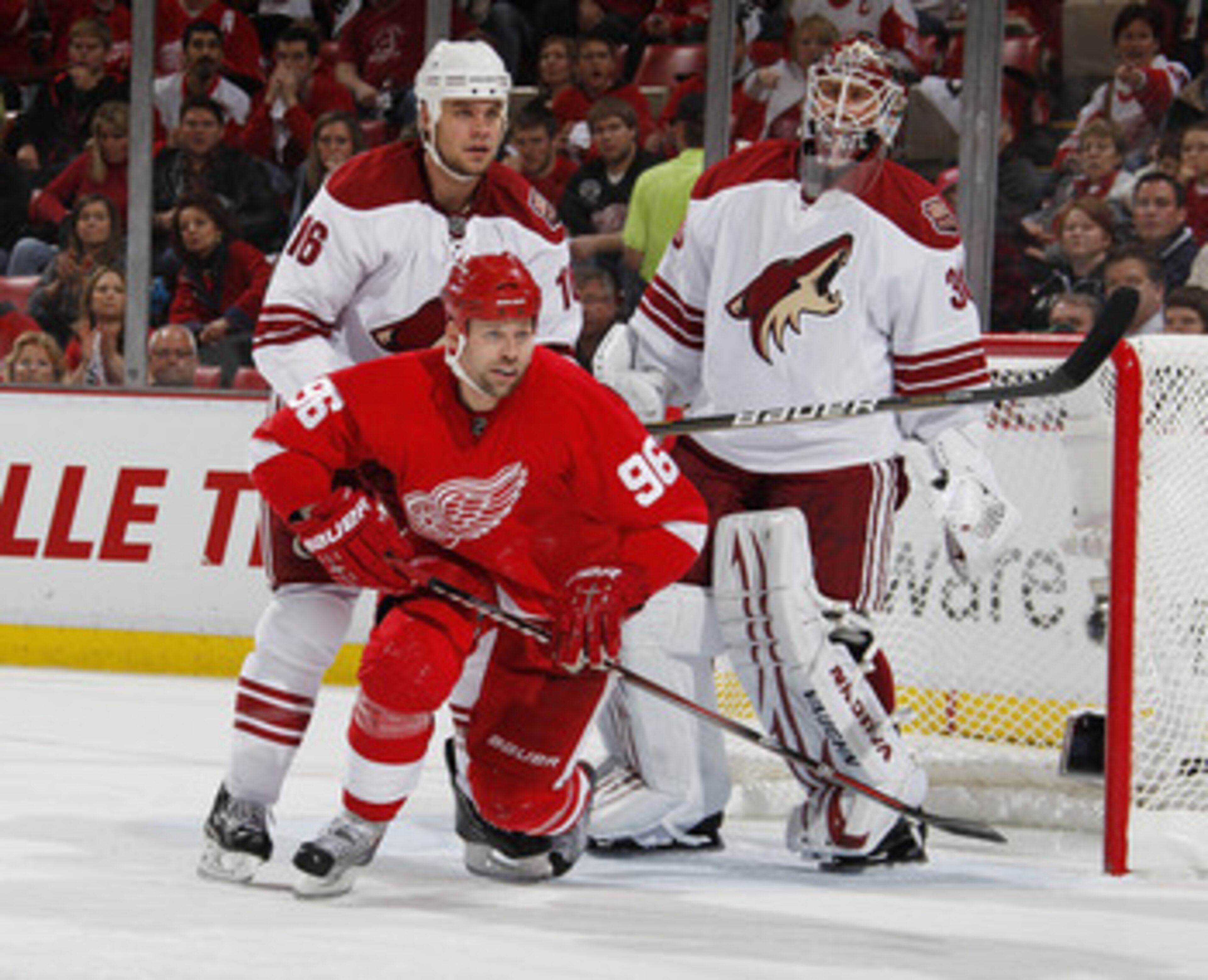 DETROIT, MI - APRIL 16: Shane Doan #19 and Ilya Bryzgalov #30 of the Phoenix Coyotes battle for position with Tomas Holmstrom #96 of the Detroit Red Wings in Game Two of the Western Conference Quarterfinals during the 2011 Stanley Cup Playoffs at Joe Loui