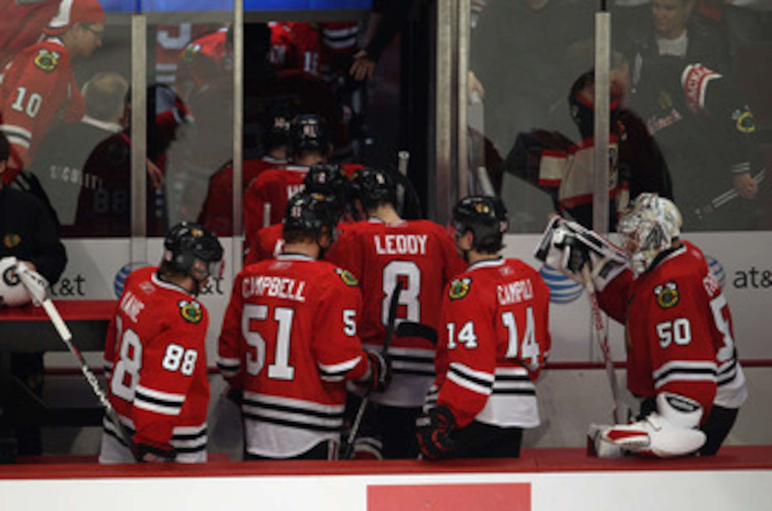 CHICAGO, IL - APRIL 17: (L-R) Patrick Kane #88, Brian Campbell #51, Nick Leddy #8, Chris Campoli and Corey Crawford #50 of the Chicago Blackhawks head down the tunnel to the locker room after a loss to the Vancouver Canucks in Game Three of the Western Co
