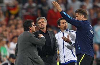 MADRID, SPAIN - APRIL 27:  Jose Mourinho the coach of Real Madrid is sent off to the stands by Thorsten Kinhofer the fourth official during the UEFA Champions League Semi Final first leg match between Real Madrid and Barcelona at Estadio Santiago Bernabeu