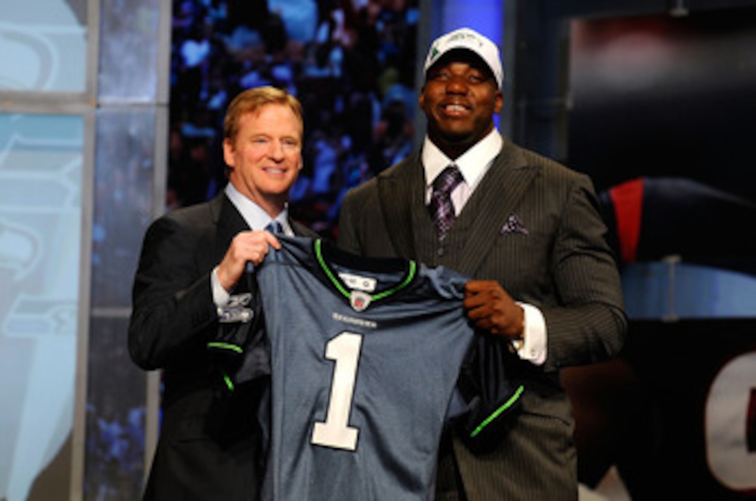 NEW YORK - APRIL 22: Russell Okung from the Oklahoma State Cowboys poses with NFL Commissioner Roger Goodell (L) as they hold a Seattle Seahawks jersey after he was selected #6 overall by the Seahawks in the first round during the 2010 NFL Draft at Radio NEW YORK - APRIL 22: Russell Okung from the Oklahoma State Cowboys poses with NFL Commissioner Roger Goodell (L) as they hold a Seattle Seahawks jersey after he was selected #6 overall by the Seahawks in the first round during the 2010 NFL Draft at Radio