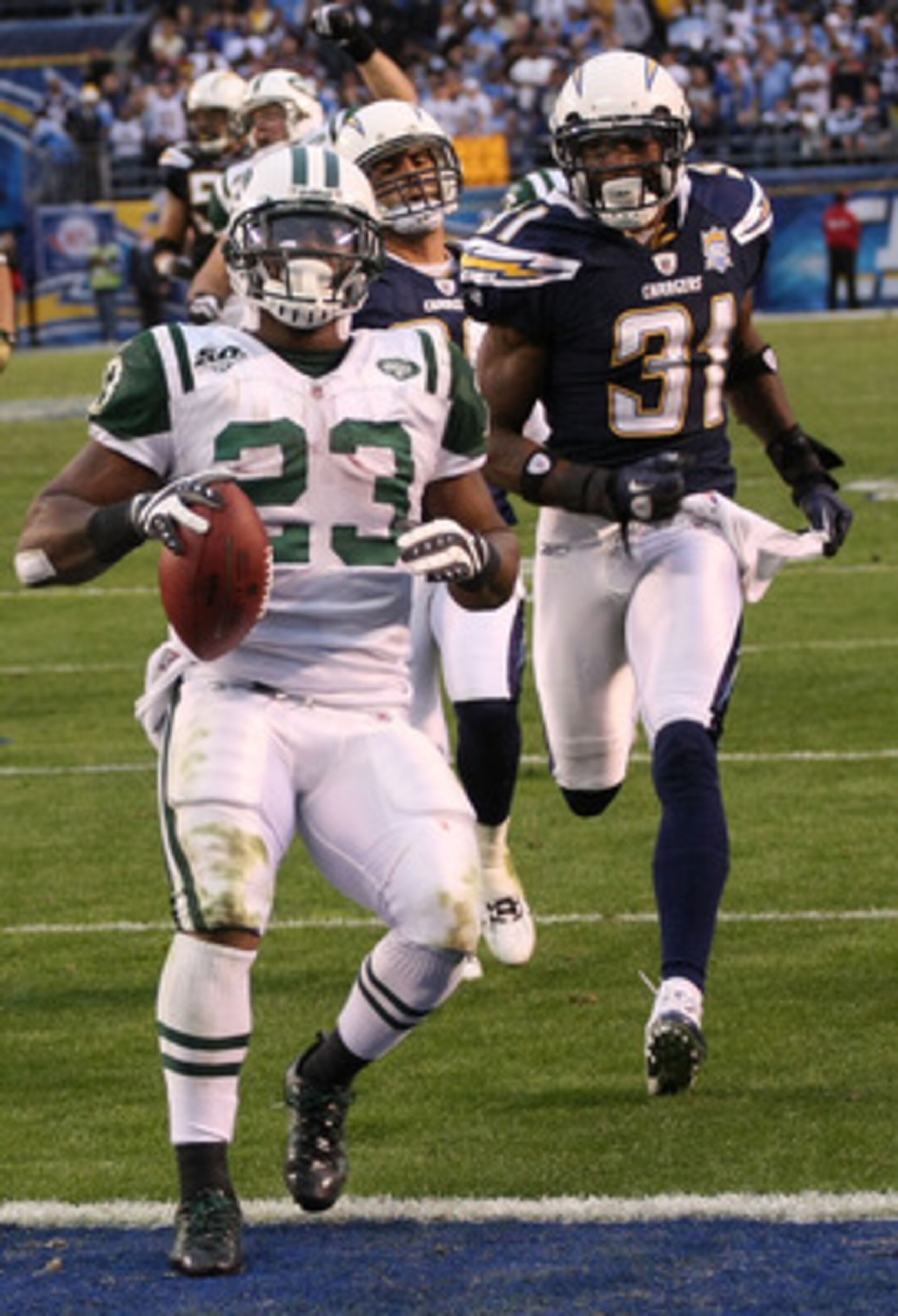 SAN DIEGO - JANUARY 17:  Running back Shonn Greene #23 of the New York Jets scores a touchdown in the fourth quarter in front of cornerback Antonio Cromartie #31 of the San Diego Chargers in the AFC Divisional Playoff Game at Qualcomm Stadium on January 1