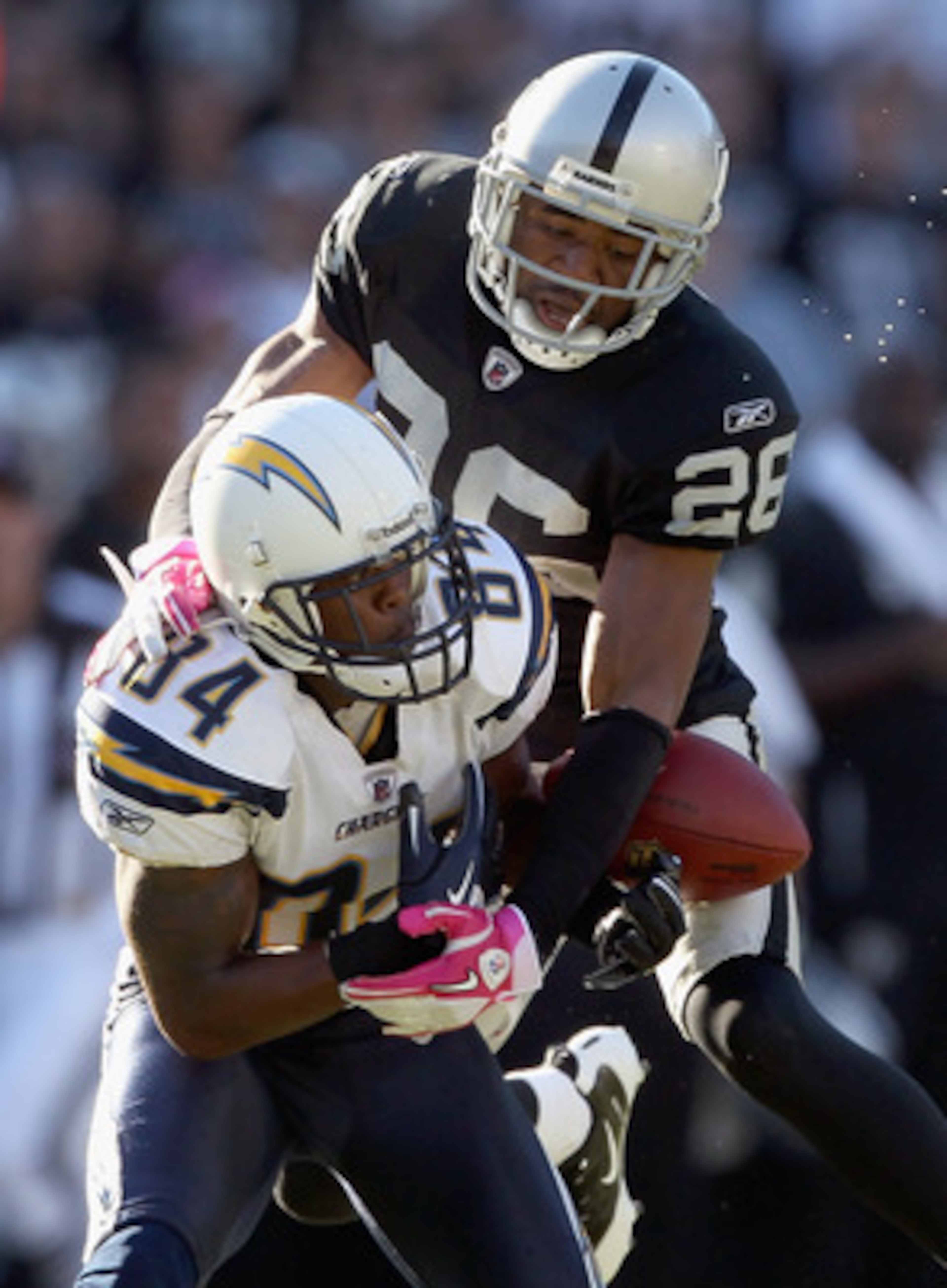 OAKLAND, CA - OCTOBER 10: Stanford Routt #26 of the Oakland Raiders breaks up a pass intended for Buster Davis #84 of the San Diego Chargers late in the fourth quarter at Oakland-Alameda County Coliseum on October 10, 2010 in Oakland, California. (Photo OAKLAND, CA - OCTOBER 10: Stanford Routt #26 of the Oakland Raiders breaks up a pass intended for Buster Davis #84 of the San Diego Chargers late in the fourth quarter at Oakland-Alameda County Coliseum on October 10, 2010 in Oakland, California. (Photo