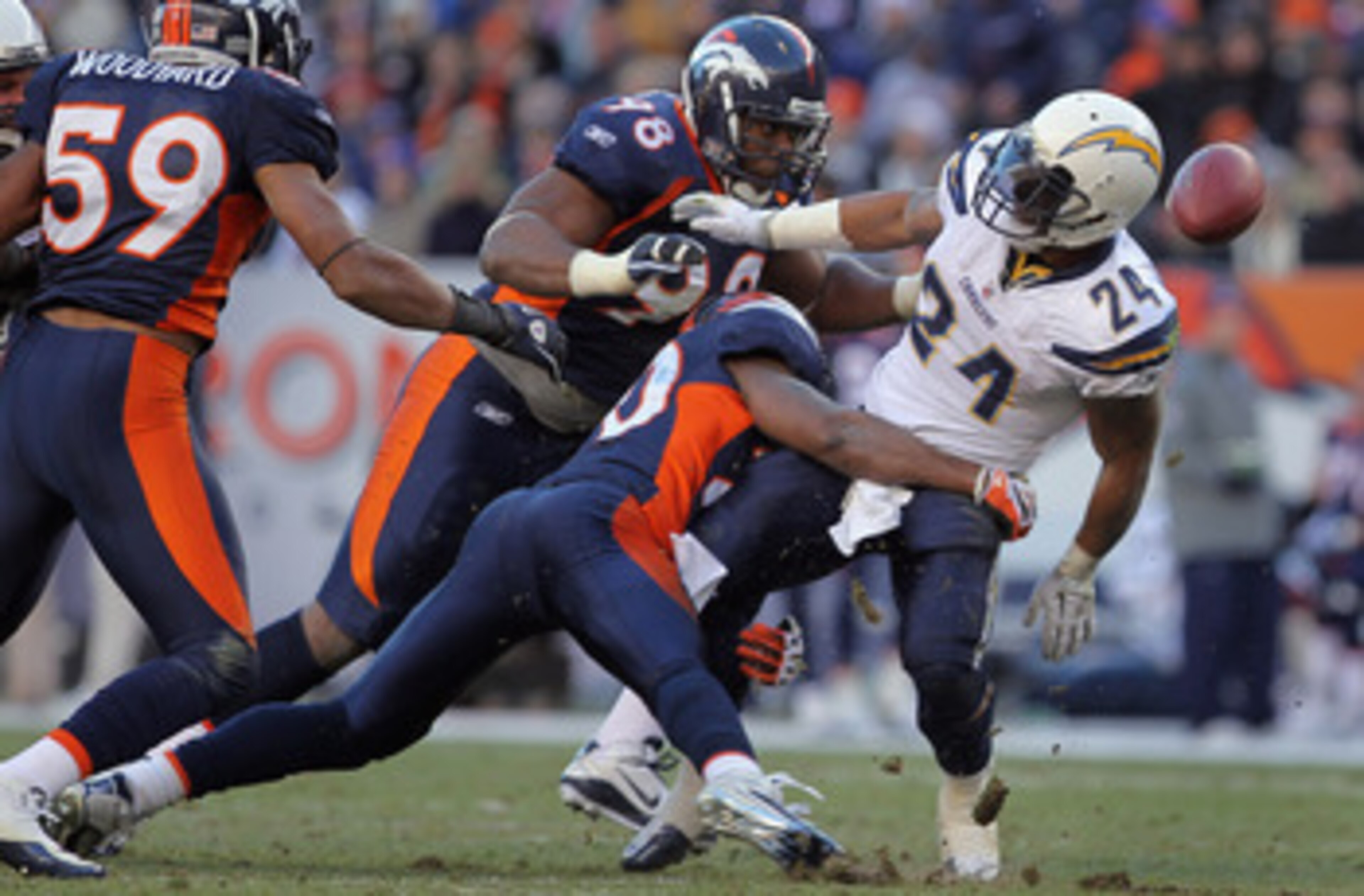DENVER - JANUARY 02: Running back Ryan Mathews #24 of the San Diego Chargers fumbles the ball as he is tackled by Brian Dawkins #20 of the Denver Broncos at INVESCO Field at Mile High on January 2, 2011 in Denver, Colorado. The ball was recovered by Kris DENVER - JANUARY 02: Running back Ryan Mathews #24 of the San Diego Chargers fumbles the ball as he is tackled by Brian Dawkins #20 of the Denver Broncos at INVESCO Field at Mile High on January 2, 2011 in Denver, Colorado. The ball was recovered by Kris