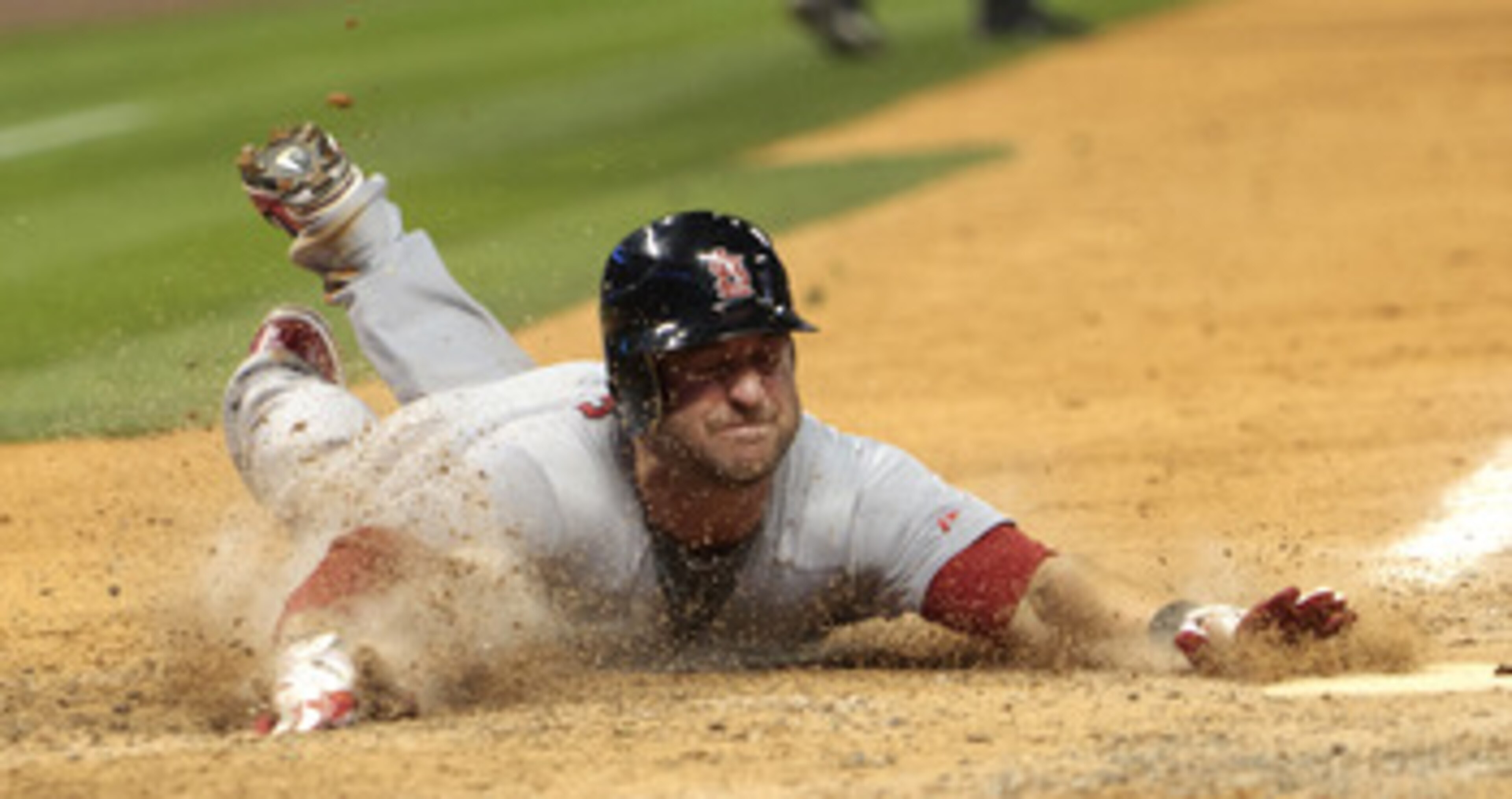 HOUSTON - APRIL 27:  Nick Punto #8 of the St. Louis Cardinals slides into home in the seventh inning on a single by Albert Pujols against the Houston Astros at Minute Maid Park on April 27, 2011 in Houston, Texas.  (Photo by Bob Levey/Getty Images)