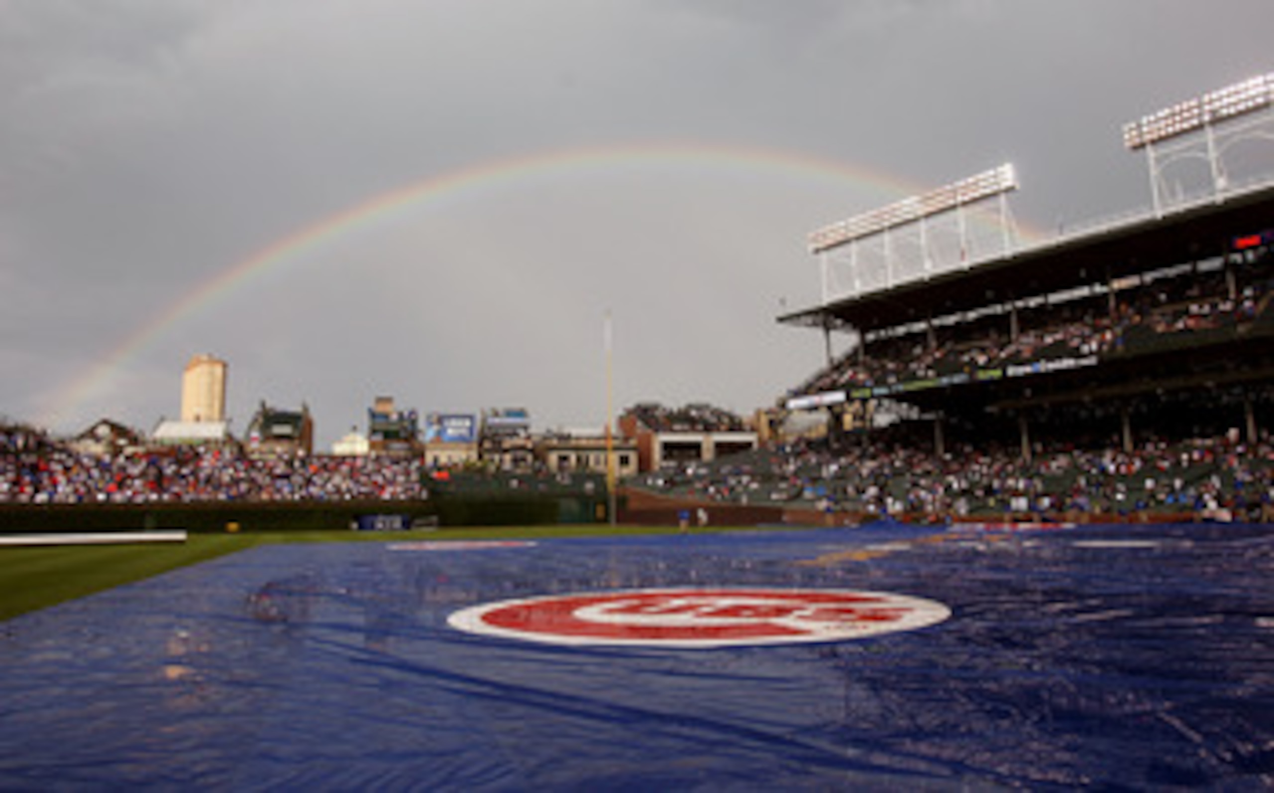 CHICAGO - JUNE 22: A rainbow appears over Wrigley Field following a short rain delay before the Chicago Cubs take on the Chicago White Sox on June 22, 2008 in Chicago, Illinois.  (Photo by Jonathan Daniel/Getty Images)
