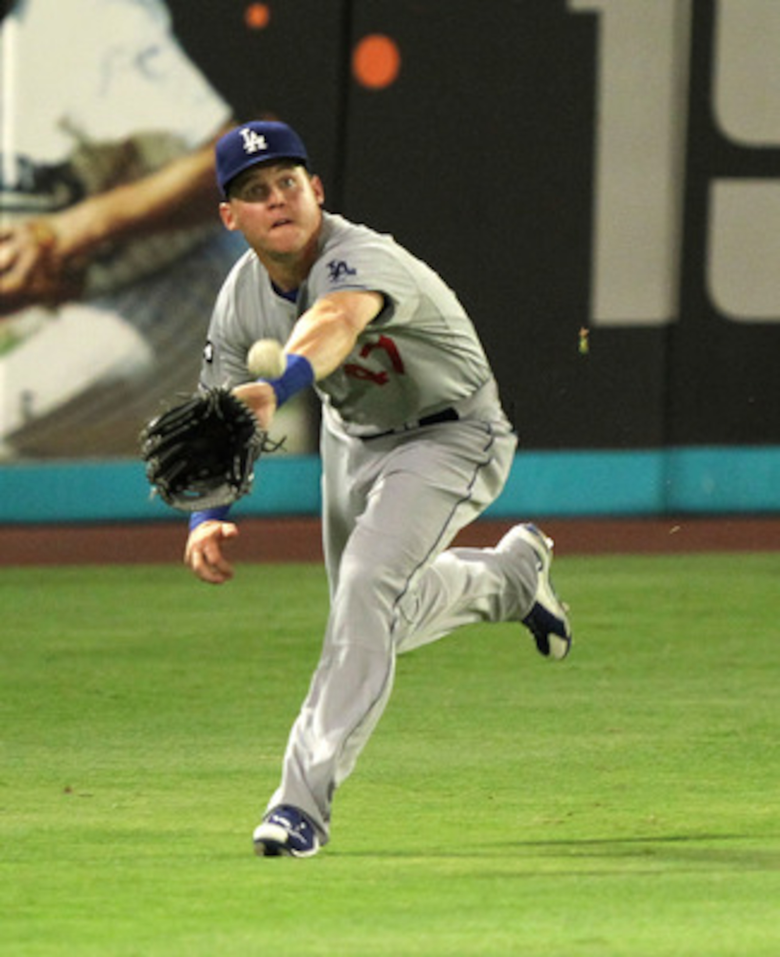 MIAMI GARDENS, FL - APRIL 26:  Jerry Sands #47 of the Los Angeles Dodgers catches a fly ball during a game against the Florida Marlins at Sun Life Stadium on April 26, 2011 in Miami Gardens, Florida.  (Photo by Mike Ehrmann/Getty Images)