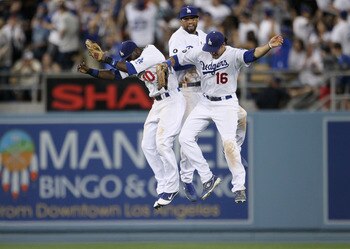 LOS ANGELES, CA - MARCH 31:  Tony Gwynn #10, Matt Kemp #27 and Andre Ethier #16 of the Los Angeles Dodgers celebrate their 2-1 win over the San Francisco Giants on Opening Day at Dodger Stadium on March 31, 2011 in Los Angeles, California.  (Photo by Jeff