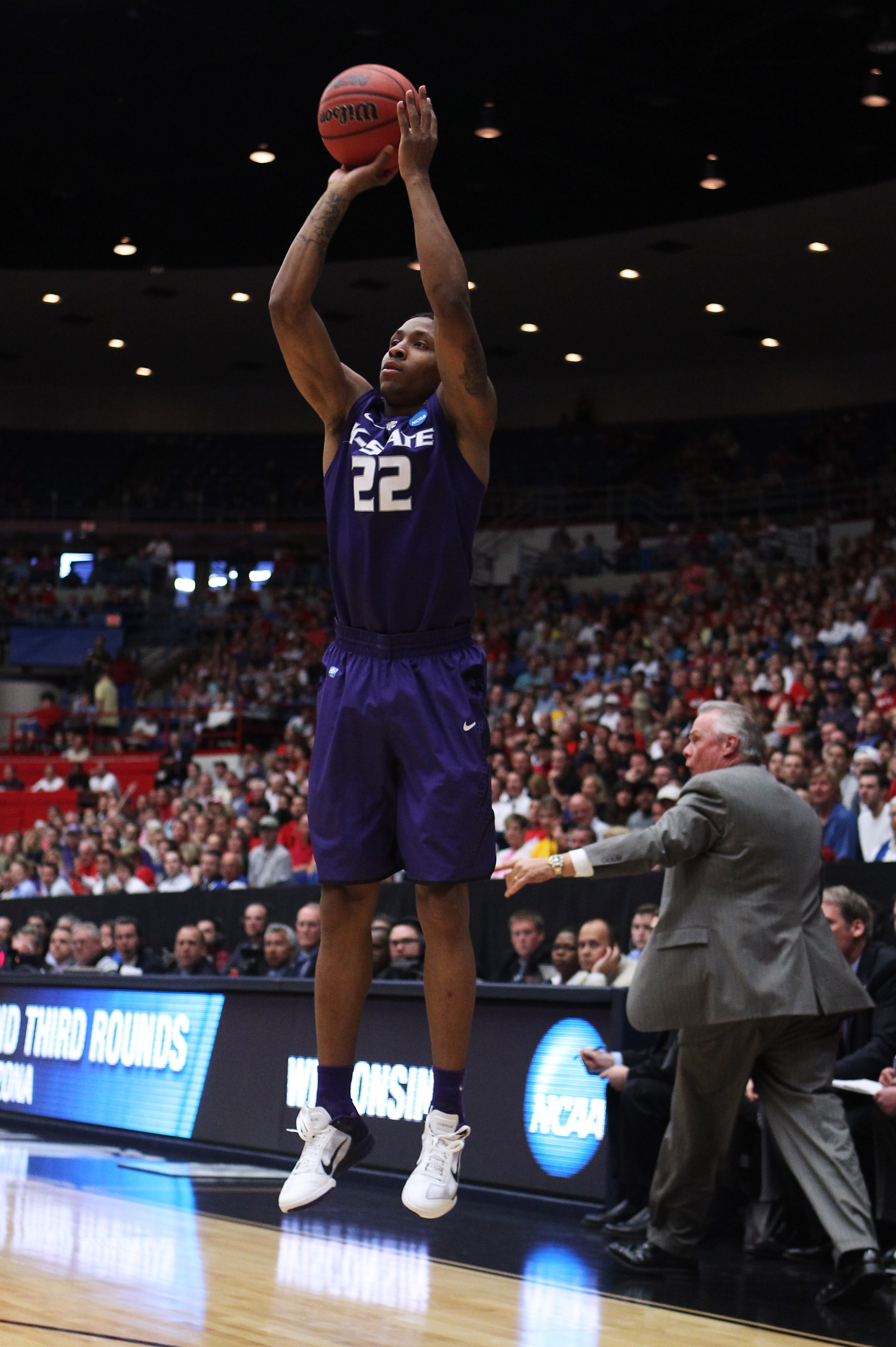 TUCSON, AZ - MARCH 19:  Rodney McGruder #22 of the Kansas State Wildcats shoots a three-pointer against the Wisconsin Badgers during the third round of the 2011 NCAA men's basketball tournament at McKale Center on March 19, 2011 in Tucson, Arizona.  (Phot