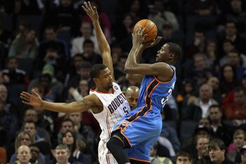CHARLOTTE, NC - DECEMBER 21:  Kevin Durant #35 of the Oklahoma Thunder shoots the ball over Dominic McGuire #5 of the Charlotte Bobcats during their game at Time Warner Cable Arena on December 21, 2010 in Charlotte, North Carolina. NOTE TO USER: User expr