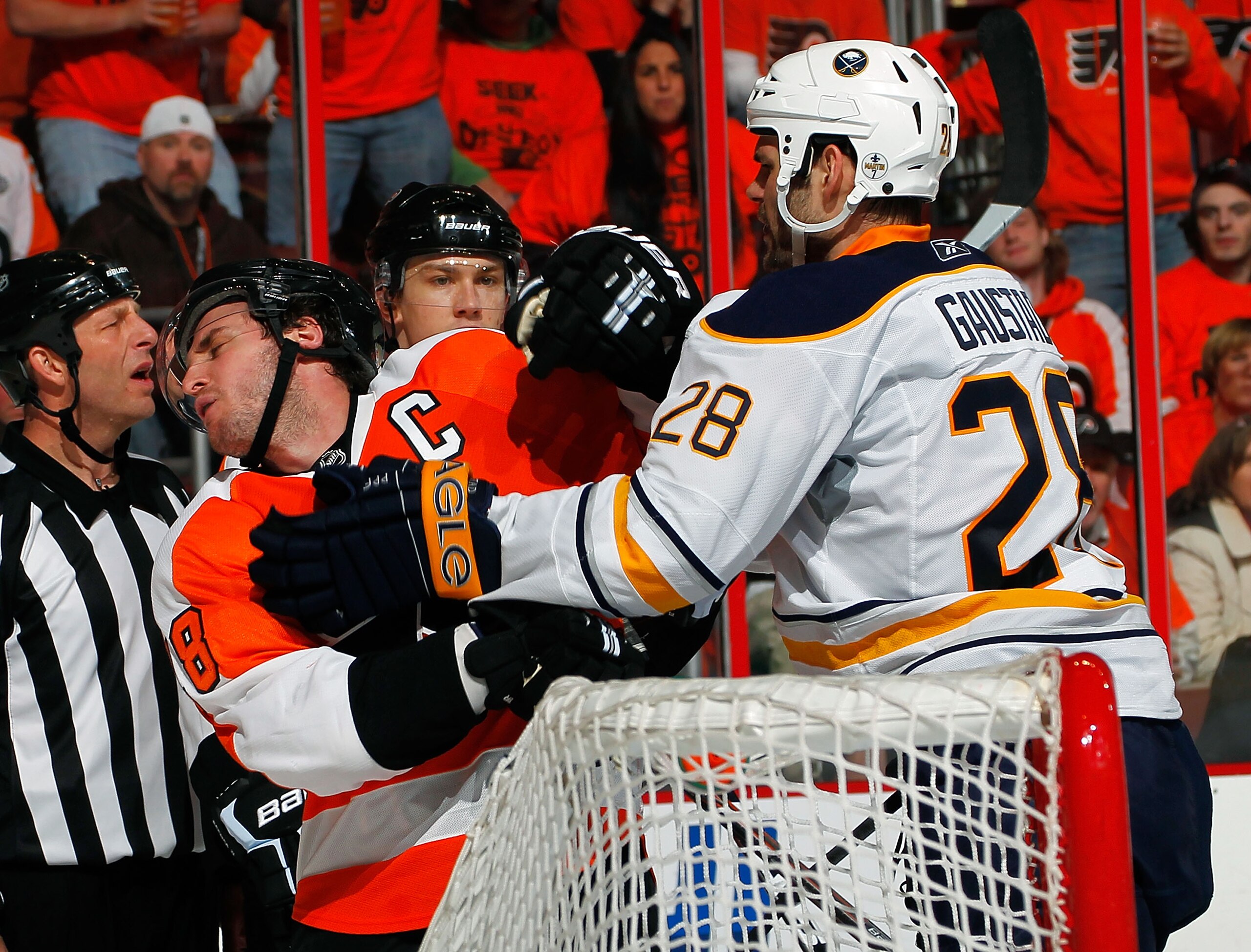 PHILADELPHIA, PA - APRIL 16:  Paul Gaustad #28 of the Buffalo Sabres roughs up Mike Richards #18 of the Philadelphia Flyers by the Buffalo net during the second period of Game Two of the Eastern Conference Quarterfinals during the 2011 NHL Stanley Cup Pla