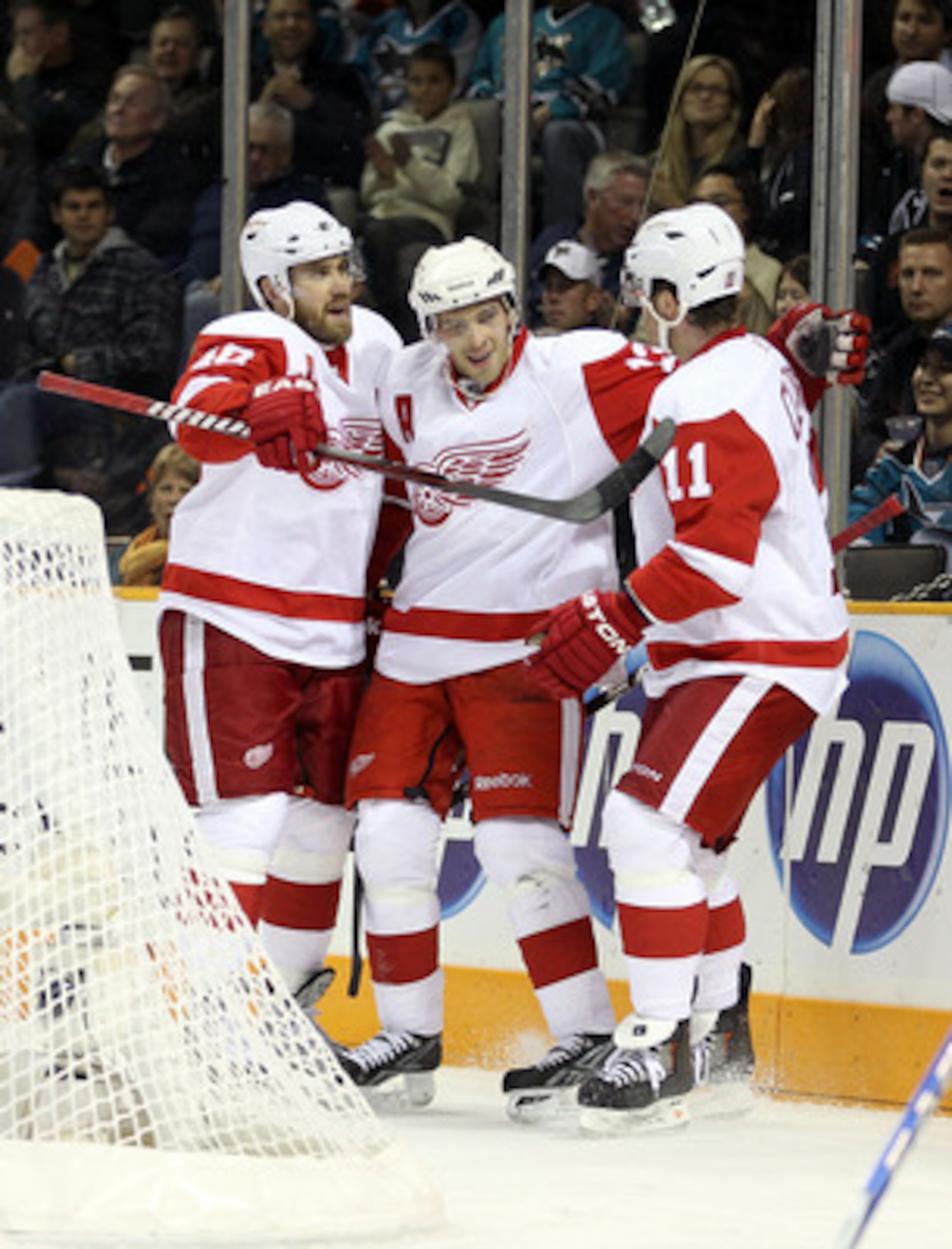 SAN JOSE, CA - NOVEMBER 30:  Pavel Datsyuk #13 of the Detroit Red Wings is congratulated by Henrik Zetterberg #40 and Daniel Cleary #11 after he scored a goal on Antero Niittymaki #30 of the San Jose Sharks at HP Pavilion on November 30, 2010 in San Jose,
