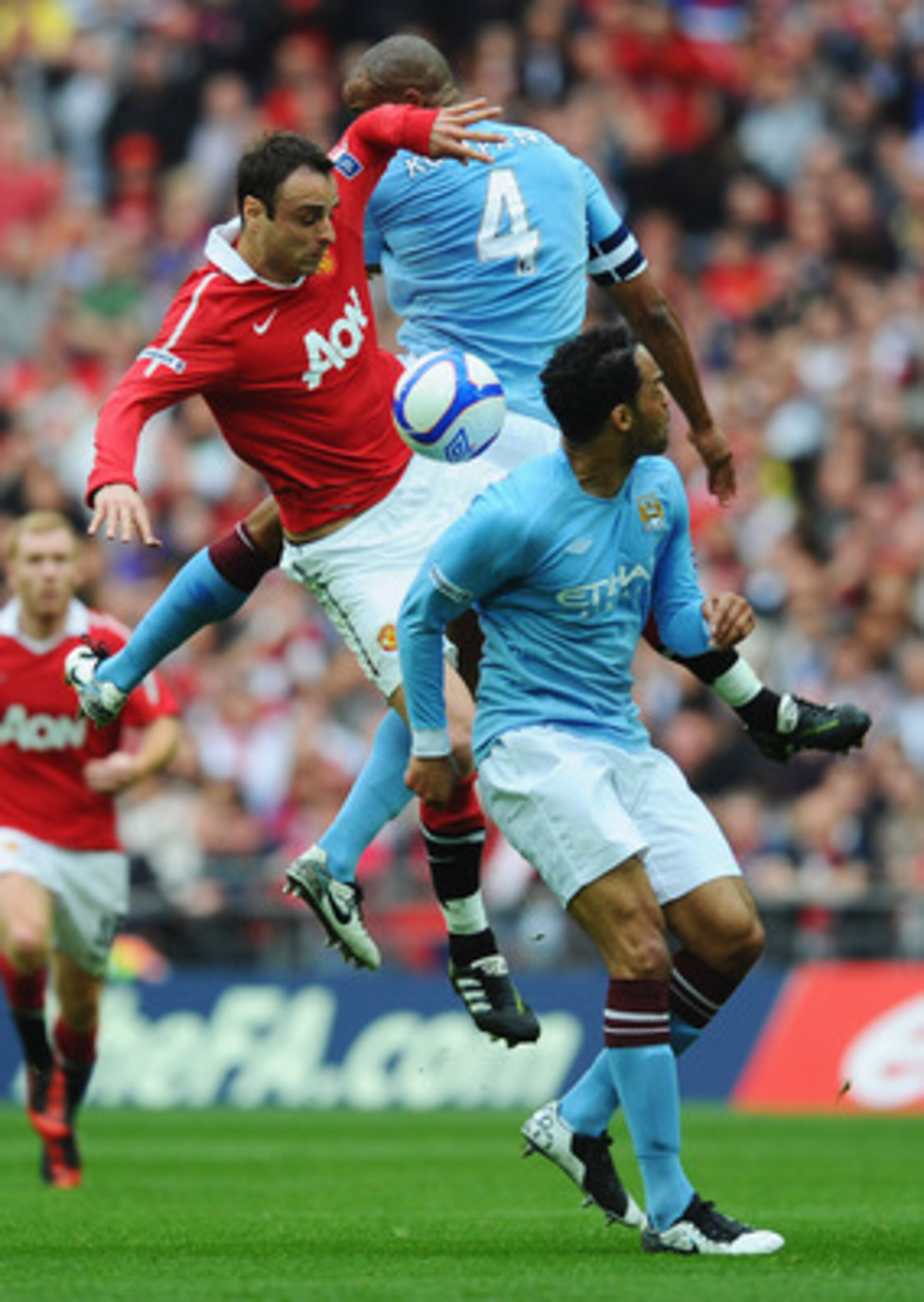 LONDON, ENGLAND - APRIL 16:  Dimitar Berbatov of Manchester United goes up for the ball with Pablo Zabaleta and Joleon Lescott of Manchester City during the FA Cup sponsored by E.ON semi final match between Manchester City and Manchester United at Wembley