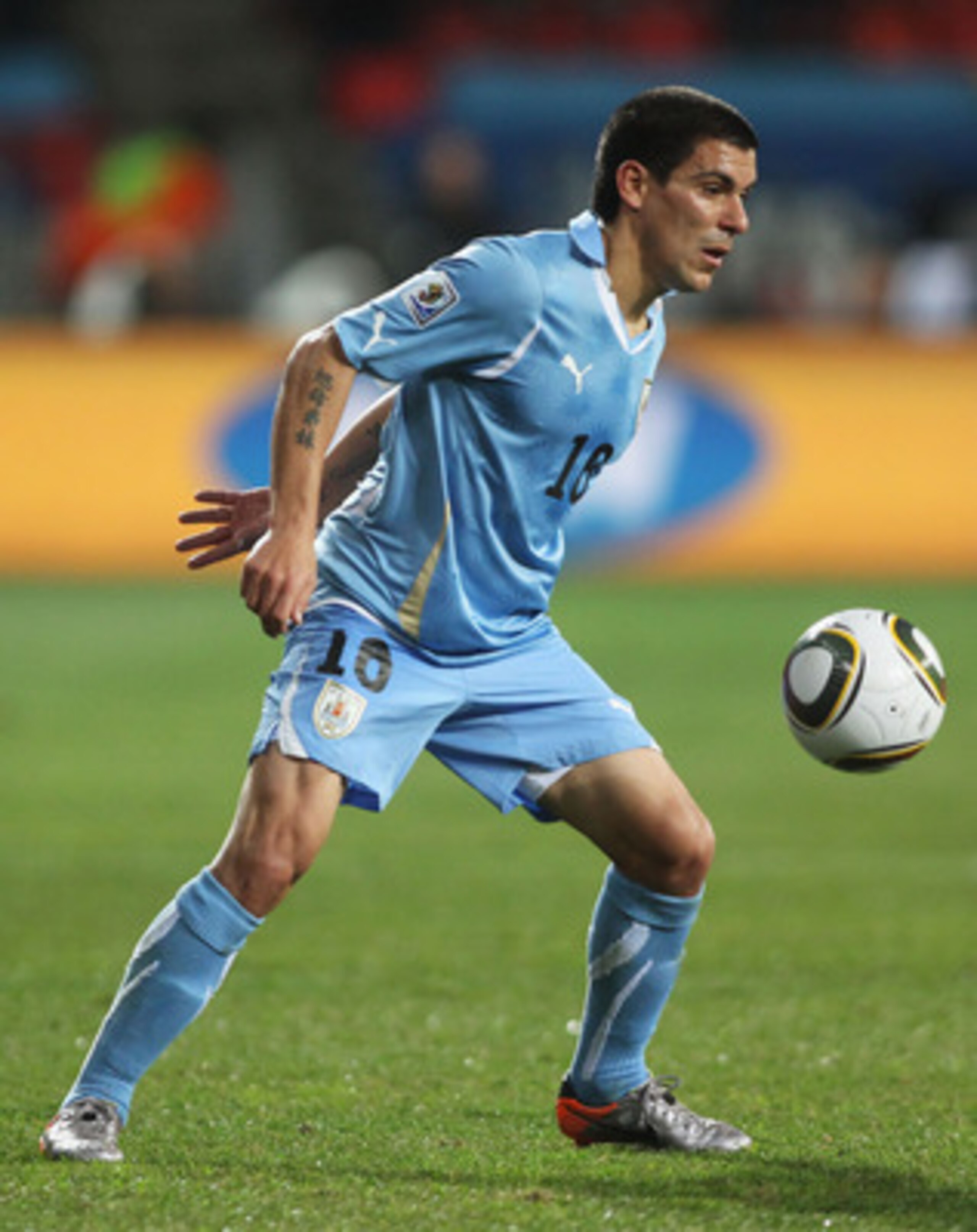 PORT ELIZABETH, SOUTH AFRICA - JULY 10:  Maximiliano Pereira of Uruguay in action during the 2010 FIFA World Cup South Africa Third Place Play-off match between Uruguay and Germany at The Nelson Mandela Bay Stadium on July 10, 2010 in Port Elizabeth, Sout