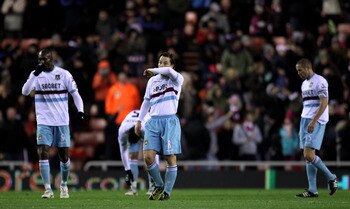 SUNDERLAND, ENGLAND - DECEMBER 05:  Scott Parker and Carlton Cole (L) of West Ham United retreat to their own half after conceding the opening goal during the Barclays Premier League match between Sunderland and West Ham United at the Stadium of Light on