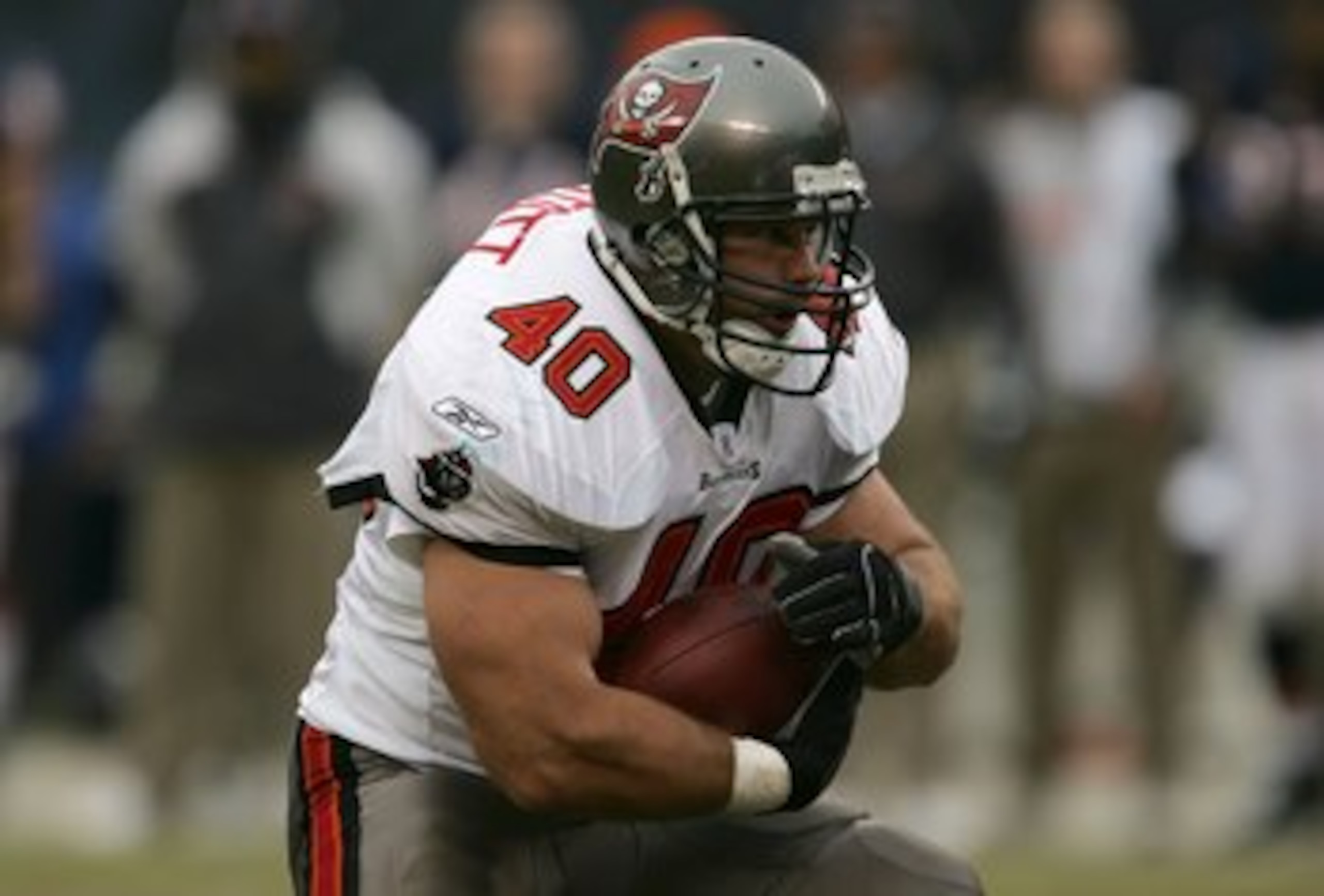 CHICAGO - DECEMBER 17:  Mike Alstott #40 of the Tampa Bay Buccaneers runs the ball in the third quarter against the Chicago Bears December 17, 2006 at Soldier Field in Chicago, Illinois. The Bears won 34-31 in overtime. (Photo by Jonathan Daniel/Getty Ima