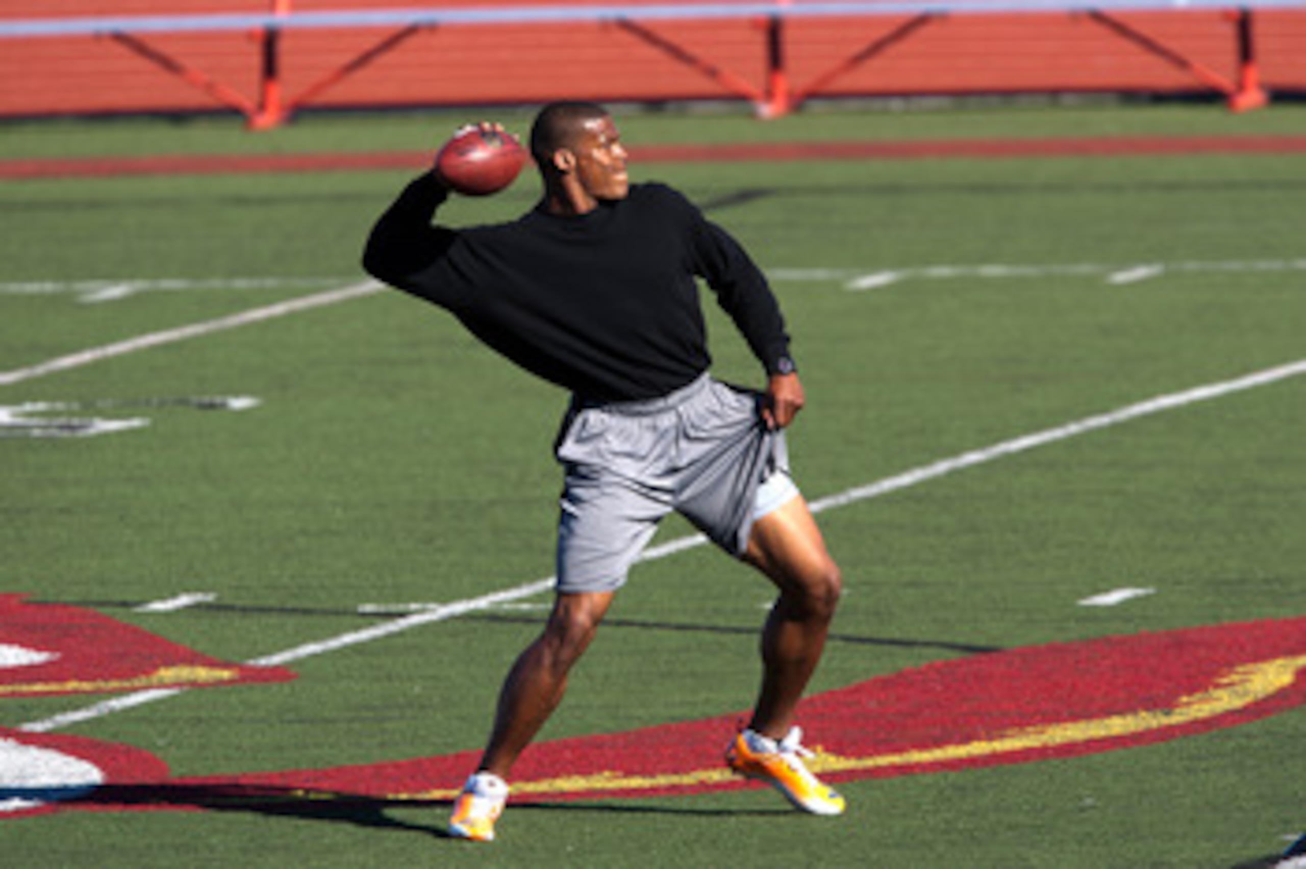 SAN DIEGO, CA - FEBRUARY 10: 2010 Heisman Trophy winning quarterback Cam Newton of the Auburn Tigers throws the ball during his workout routine for the media at Cathedral High School's sports stadium on February 10, 2011 in San Diego, California. (Photo SAN DIEGO, CA - FEBRUARY 10: 2010 Heisman Trophy winning quarterback Cam Newton of the Auburn Tigers throws the ball during his workout routine for the media at Cathedral High School's sports stadium on February 10, 2011 in San Diego, California. (Photo