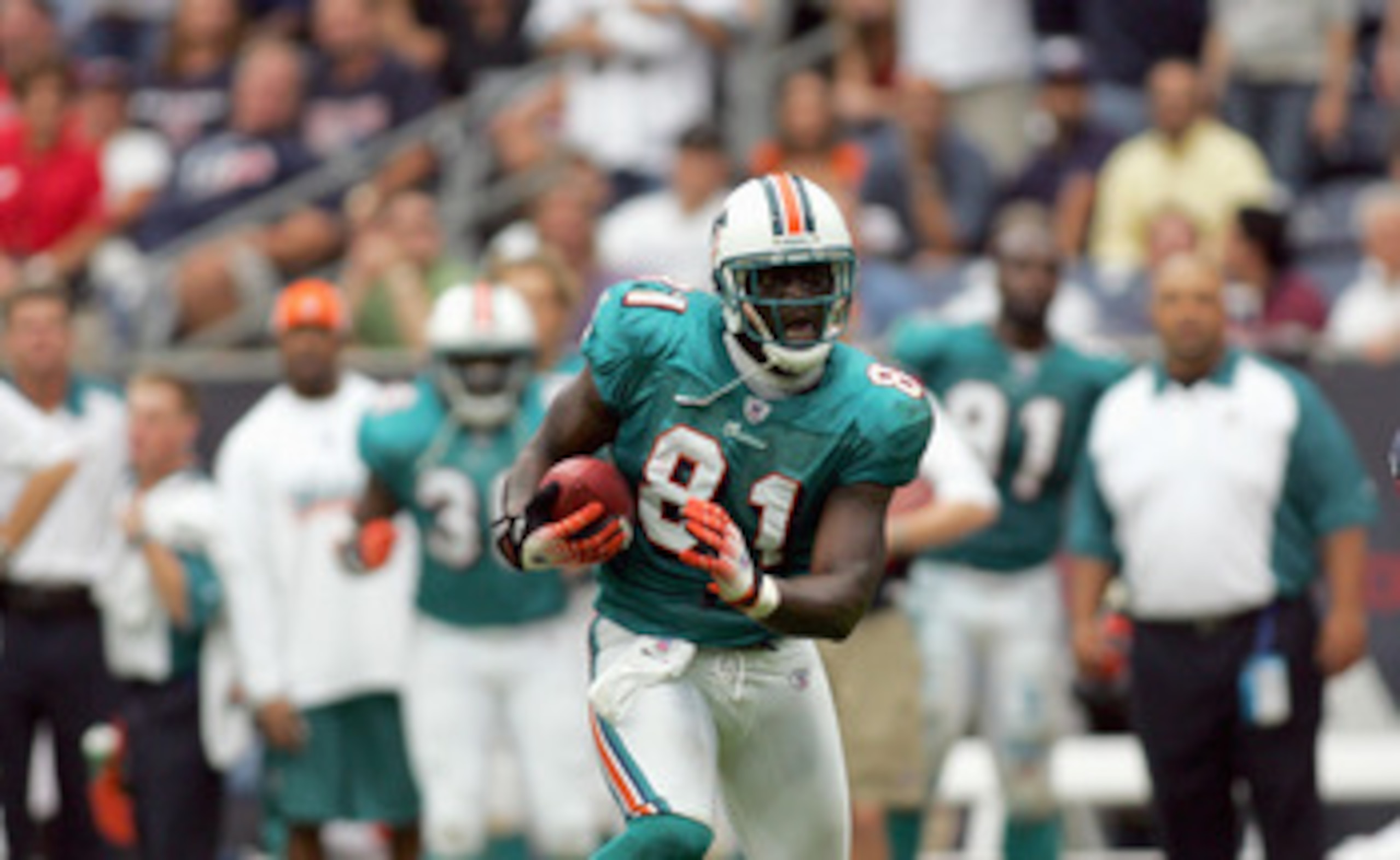 HOUSTON -OCTOBER 1: Randy McMichael #81 of the Miami Dolphins carries the ball during the game against the Houston Texans at Reliant Stadium on October 1, 2006 in Houston, Texas. (Photo by Ronald Martinez/Getty Images) HOUSTON -OCTOBER 1: Randy McMichael #81 of the Miami Dolphins carries the ball during the game against the Houston Texans at Reliant Stadium on October 1, 2006 in Houston, Texas. (Photo by Ronald Martinez/Getty Images)