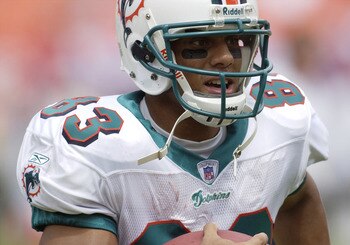 Miami Dolphins wide receiver Sam Simmons grabs a warm-up pass   September 7, 2003 at Pro Player Stadium, Miami, Florida. The  Houston Texans defeated the Dolphins 21 - 20 to open the NFL football season.  (Photo by Al Messerschmidt/Getty Images)