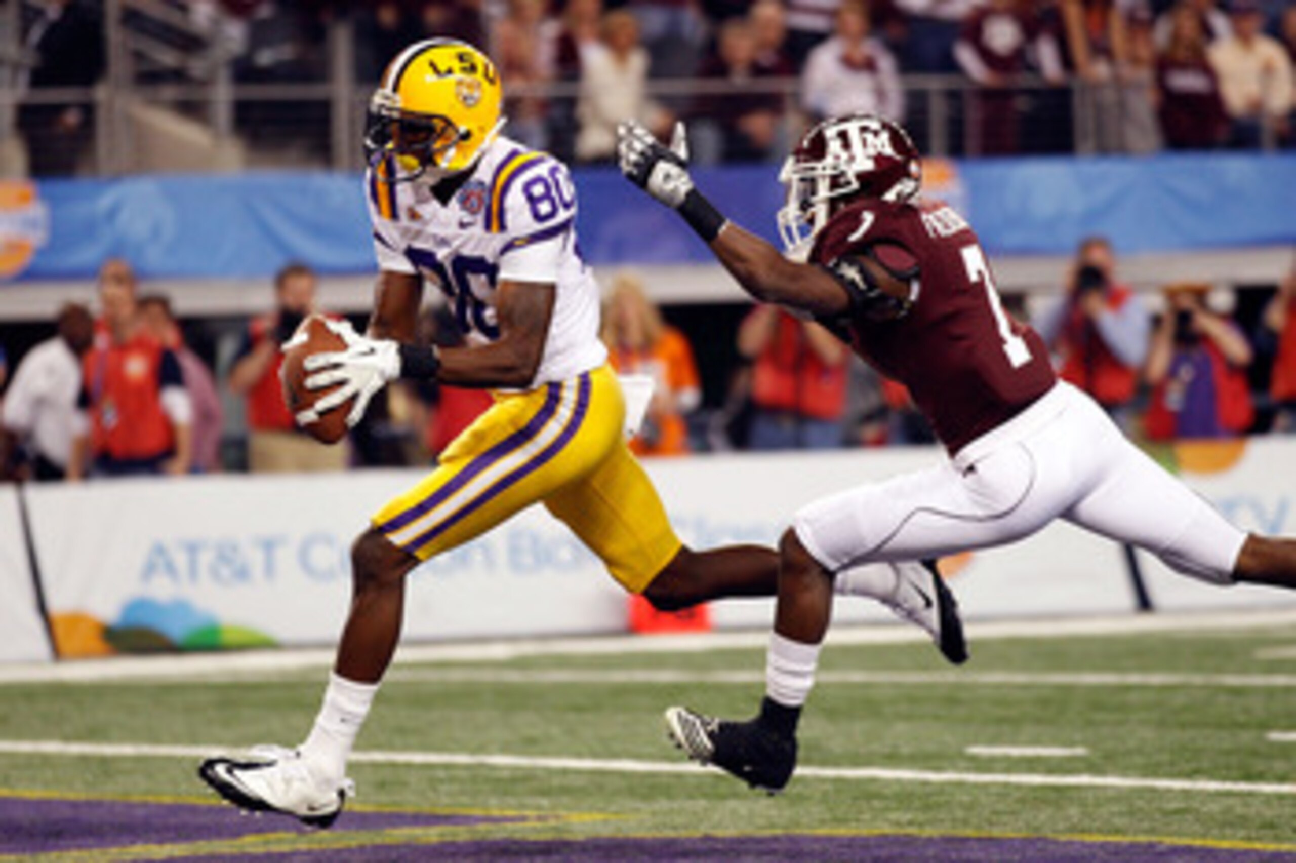 ARLINGTON, TX - JANUARY 07: Terrence Toliver #80 of the Louisiana State University Tigers catches a touchdown pass over Terrence McCoy #7 of the Texas A&M Aggies during the AT&T Cotton Bowl at Cowboys Stadium on January 7, 2011 in Arlington, Texas. (Pho ARLINGTON, TX - JANUARY 07: Terrence Toliver #80 of the Louisiana State University Tigers catches a touchdown pass over Terrence McCoy #7 of the Texas A&M Aggies during the AT&T Cotton Bowl at Cowboys Stadium on January 7, 2011 in Arlington, Texas. (Pho