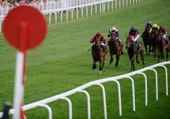 EPSOM, ENGLAND - APRIL 20:  Sunny Game ridden by jockey Jamie Spencer (L) win the Investec Great Metropolitan Handicap Stakes during Epsom Races at Epsom racecourse on April 20, 2011 in Epsom, England.  (Photo by Alan Crowhurst/ Getty Images)
