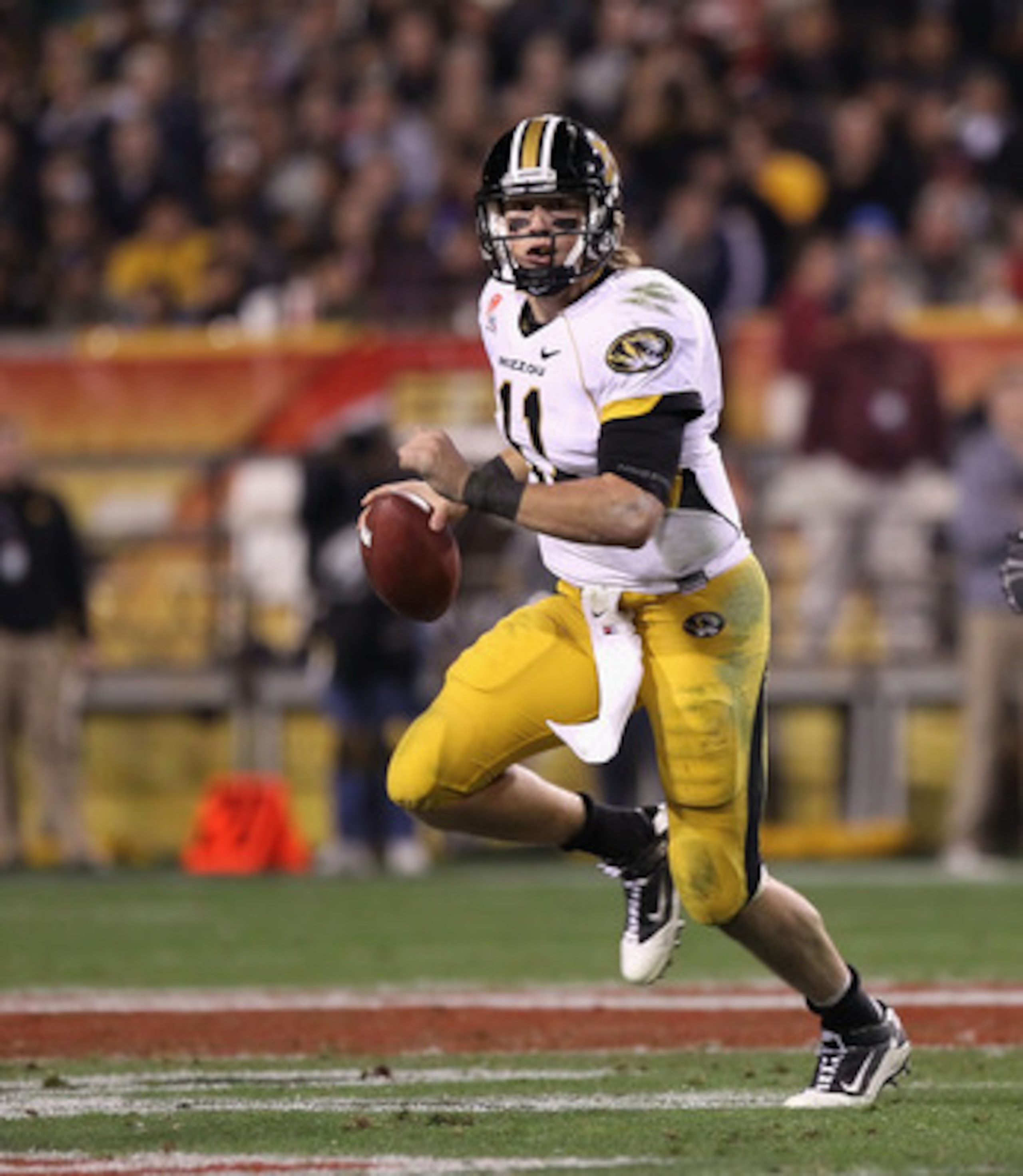 TEMPE, AZ - DECEMBER 28:  Quarterback Blaine Gabbert #11 of the Missouri Tigers drops back to pass during the Insight Bowl against the Iowa Hawkeyes  at Sun Devil Stadium on December 28, 2010 in Tempe, Arizona.  The Hawkeyes defeated the Tigers 27-24.  (P