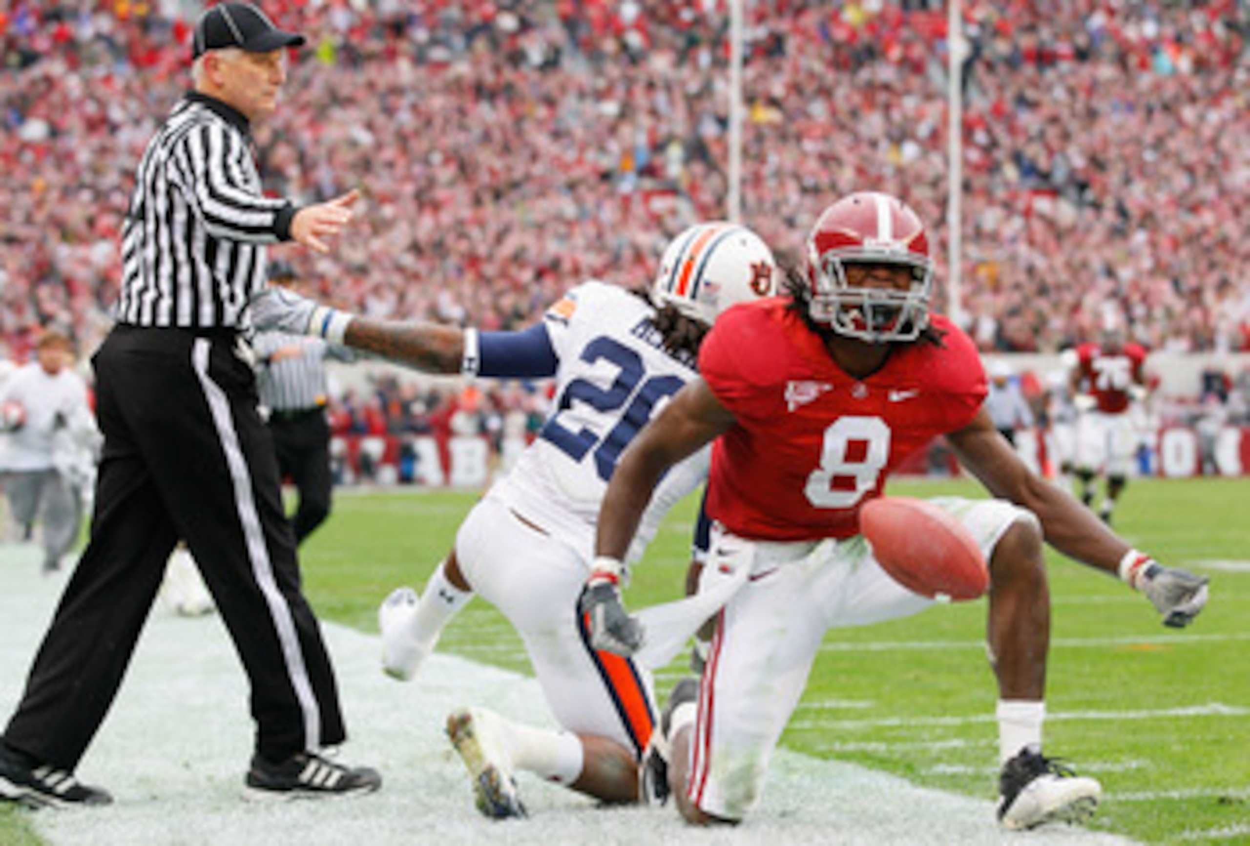 TUSCALOOSA, AL - NOVEMBER 26: Julio Jones #8 of the Alabama Crimson Tide reacts after a long reception against Mike McNeil #26 of the Auburn Tigers at Bryant-Denny Stadium on November 26, 2010 in Tuscaloosa, Alabama. (Photo by Kevin C. Cox/Getty Images) TUSCALOOSA, AL - NOVEMBER 26: Julio Jones #8 of the Alabama Crimson Tide reacts after a long reception against Mike McNeil #26 of the Auburn Tigers at Bryant-Denny Stadium on November 26, 2010 in Tuscaloosa, Alabama. (Photo by Kevin C. Cox/Getty Images)