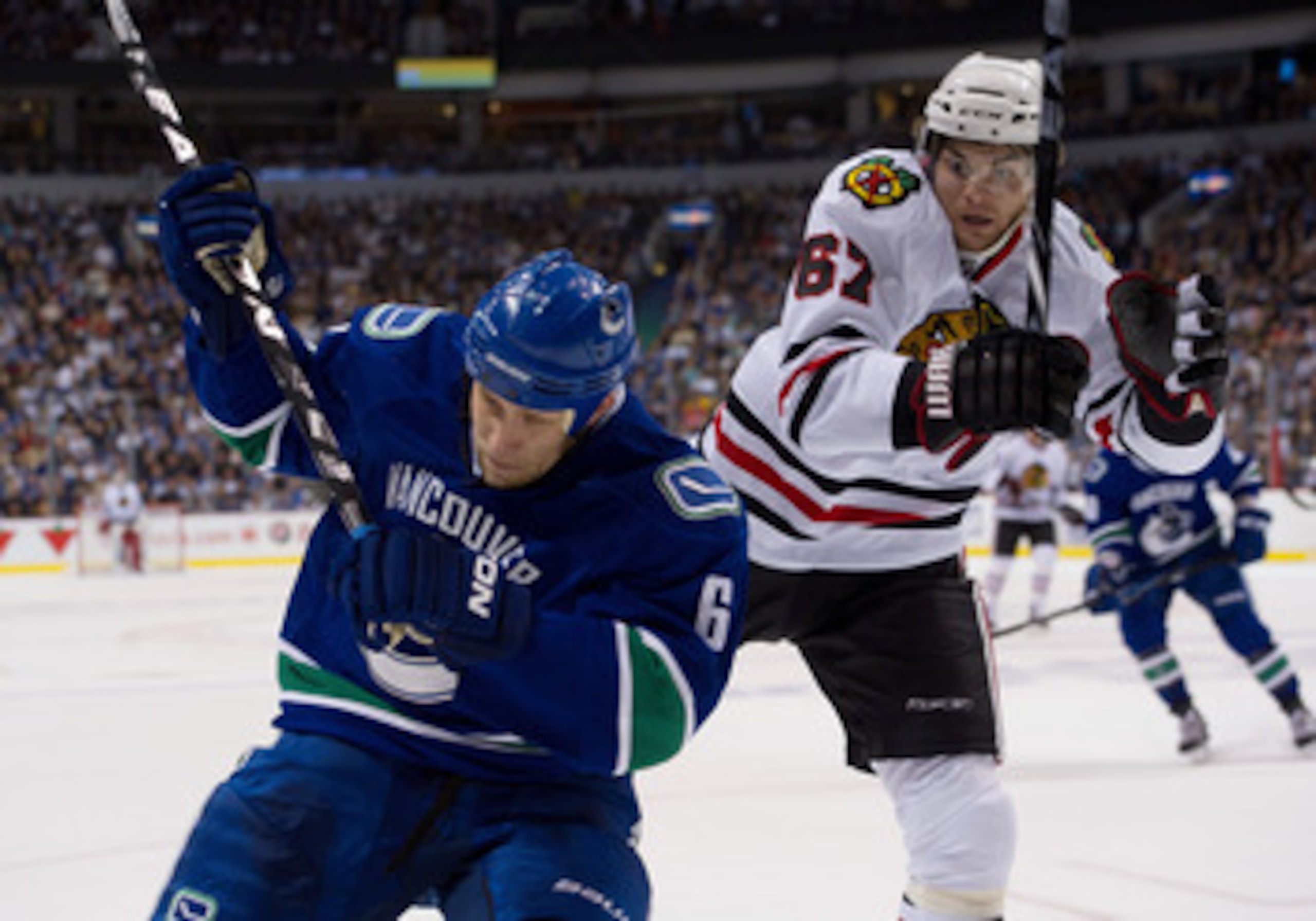 VANCOUVER, CANADA - APRIL 15: Michael Frolik #67 of the Chicago Blackhawks watches as Sami Salo #6 of the Vancouver Canucks attack the puck during the second period in Game Two of the Western Conference Quarterfinals during the 2011 NHL Stanley Cup Playof