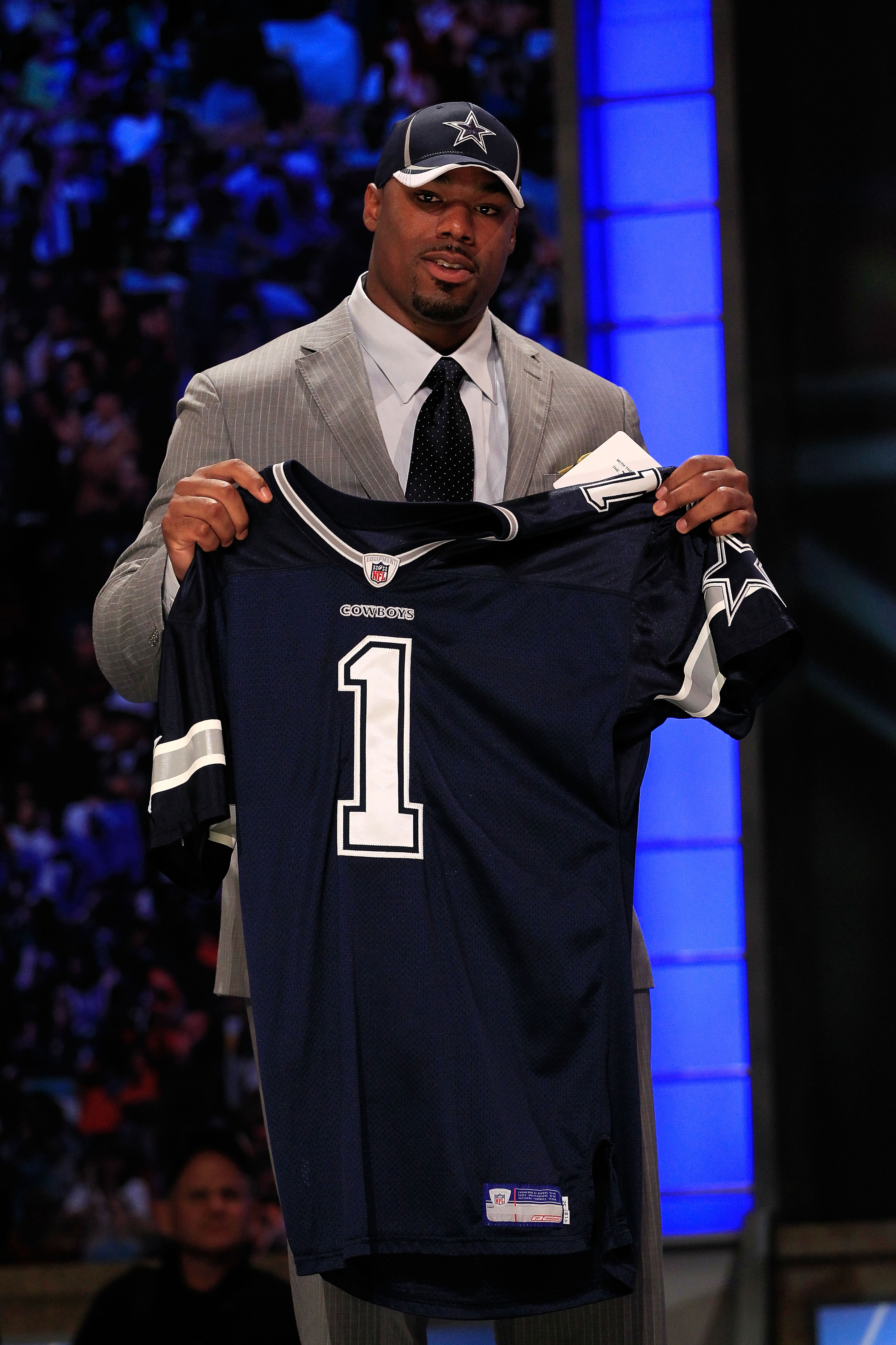 NEW YORK, NY - APRIL 28:  Tyron Smith, #9 overall pick by the Dallas Cowboys, holds up a jersey on stage during the 2011 NFL Draft at Radio City Music Hall on April 28, 2011 in New York City.  (Photo by Chris Trotman/Getty Images)