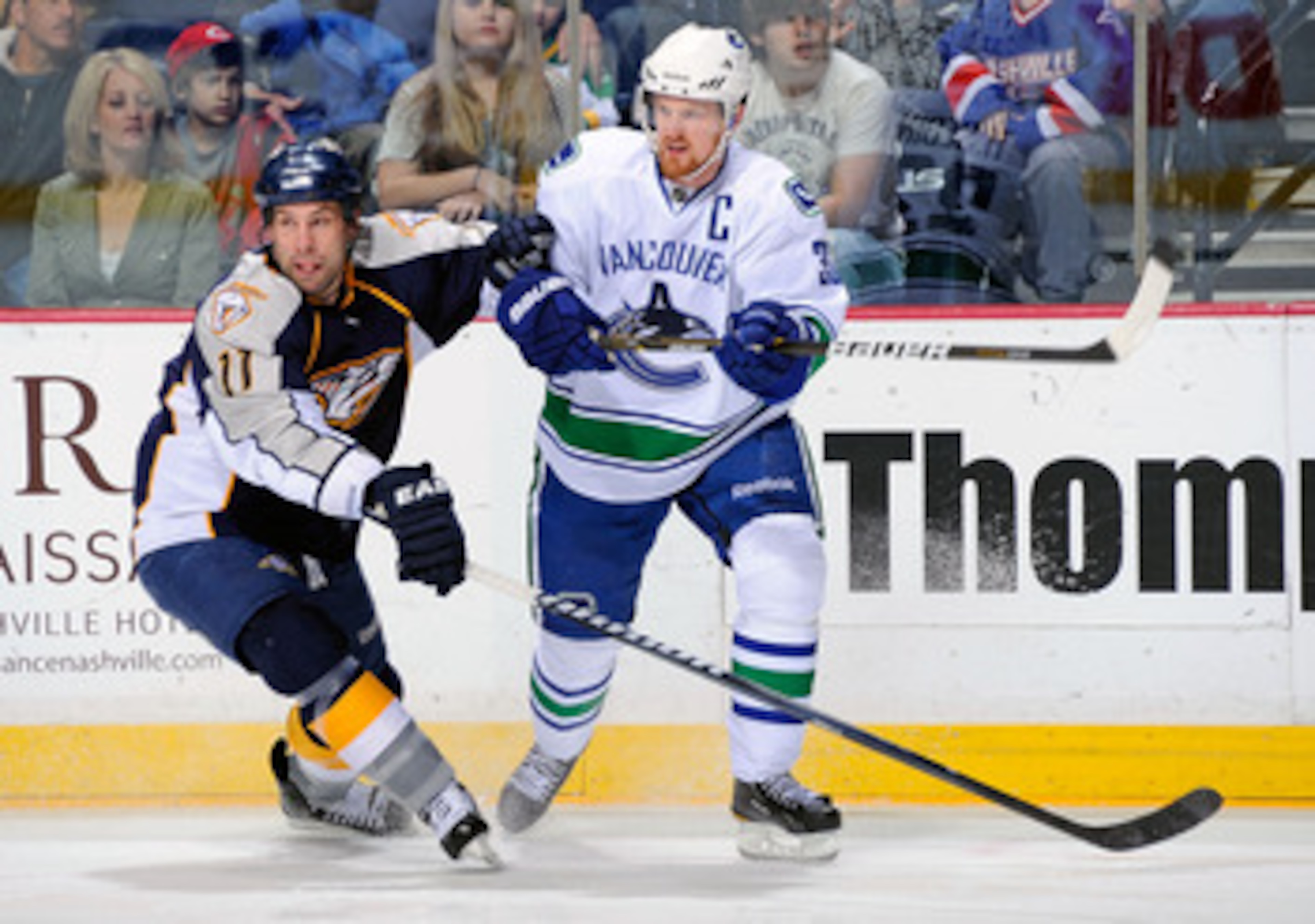 NASHVILLE, TN - MARCH 29:  Henrik Sedin #33 of the Vancouver Canucks skates against David Legwand #11 of the Nashville Predators on March 29, 2011 at the Bridgestone Arena in Nashville, Tennessee.  (Photo by Frederick Breedon/Getty Images)
