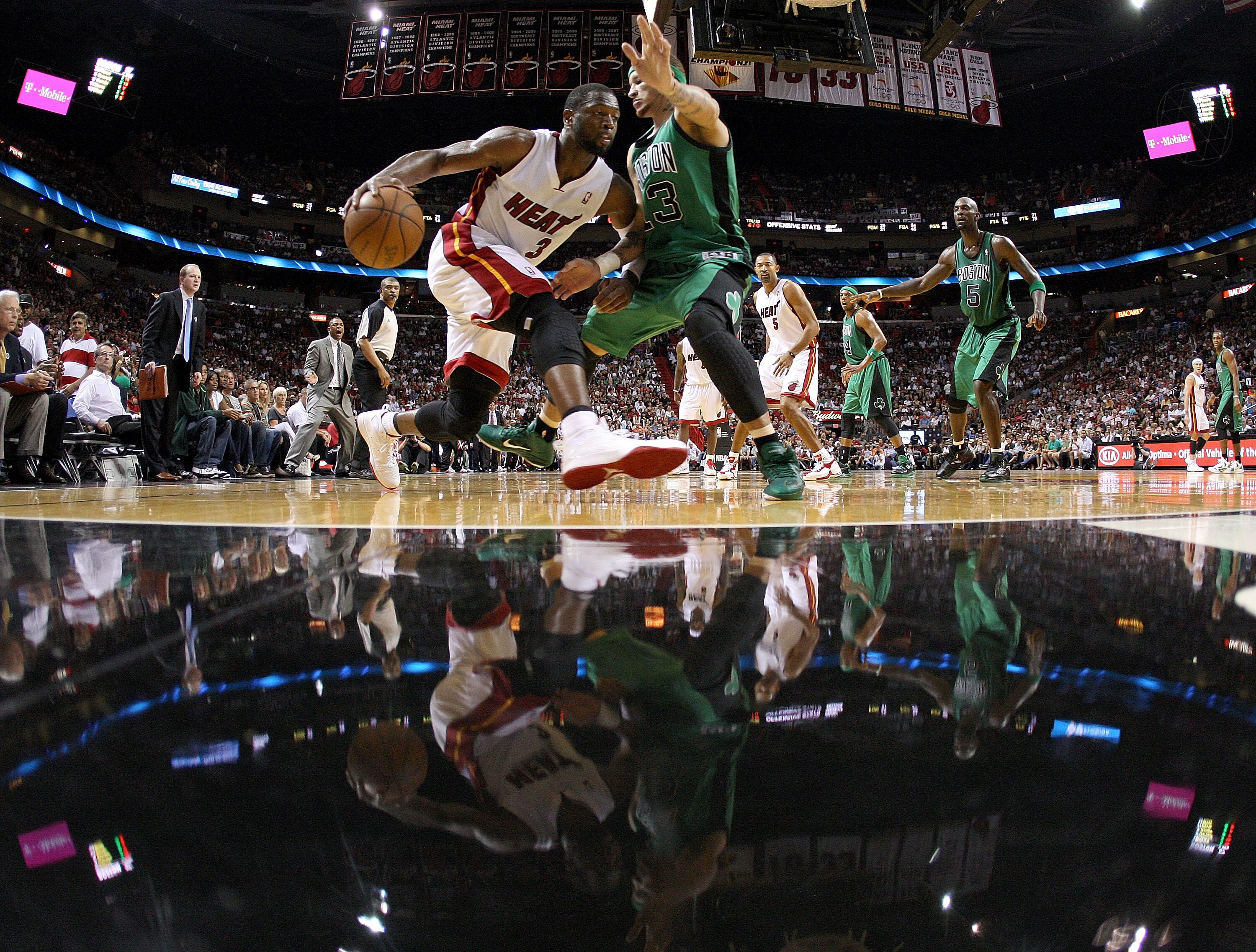 MIAMI, FL - APRIL 10:  Dwyane Wade #3 of the Miami Heat drives on Delonte West #13 of the Boston Celtics during a game  at American Airlines Arena on April 10, 2011 in Miami, Florida. NOTE TO USER: User expressly acknowledges and agrees that, by downloadi
