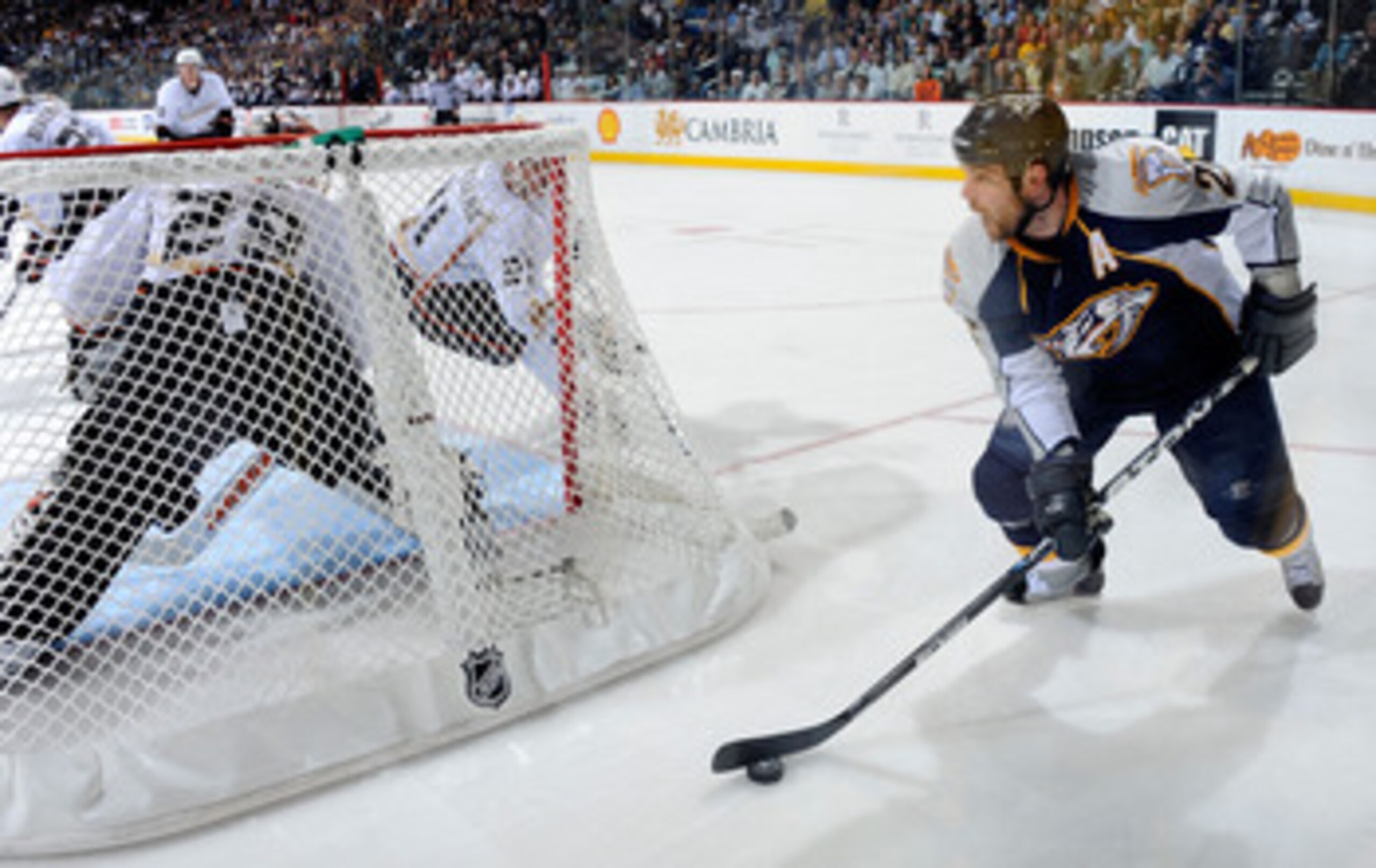 NASHVILLE, TN - APRIL 17:   Steve Sullivan #26 of the Nashville Predators carries the puck behind goalie Ray Emery #29 of the Anaheim Ducks in Game Three of the Western Conference Quarterfinals during the 2011 NHL Stanley Cup Playoffs at the Bridgestone A