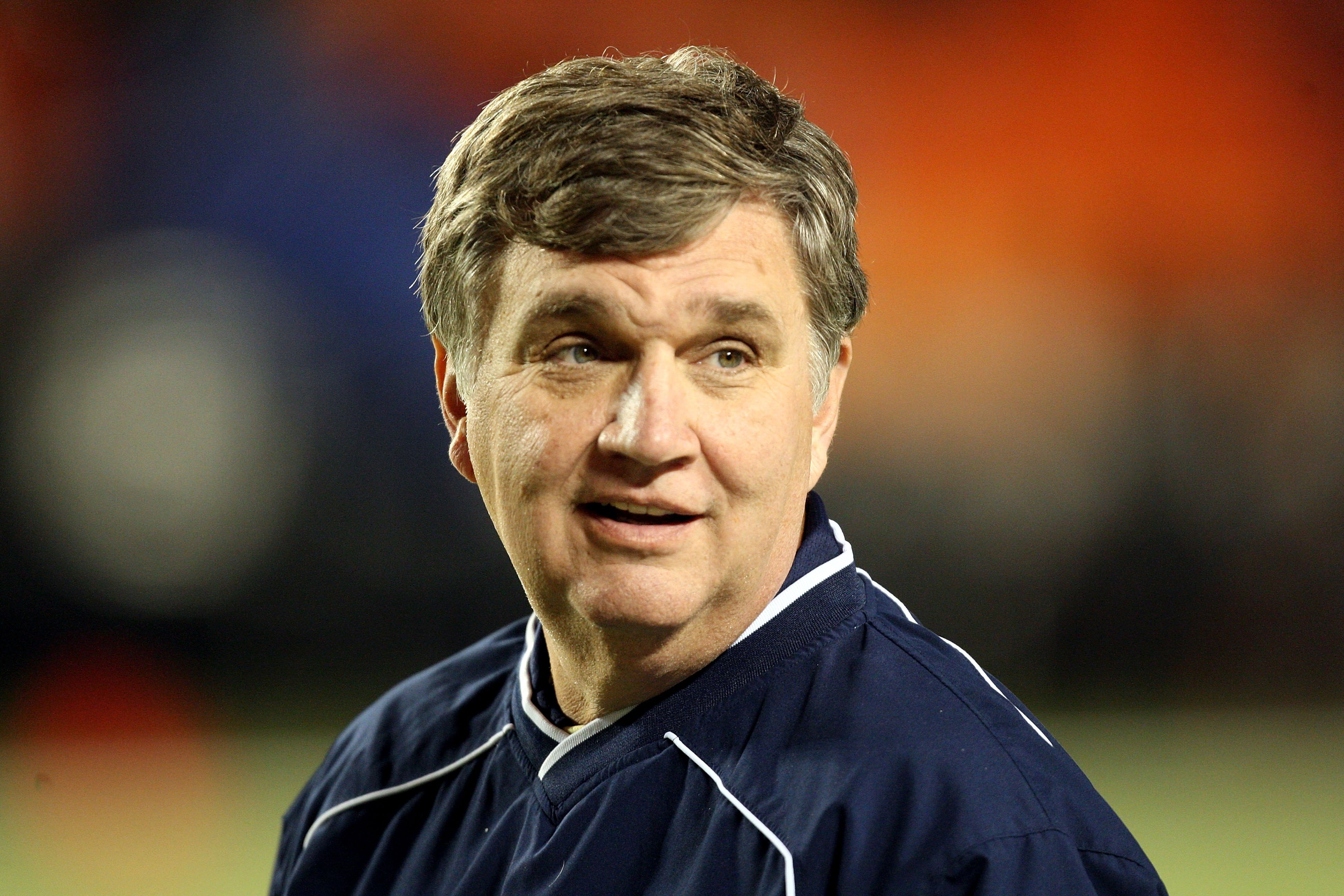 MIAMI GARDENS, FL - JANUARY 05:  Head coach Paul Johnson of the Georgia Tech Yellow Jackets smiles on the field during warm ups against the Iowa Hawkeyes during the FedEx Orange Bowl at Land Shark Stadium on January 5, 2010 in Miami Gardens, Florida. Iowa