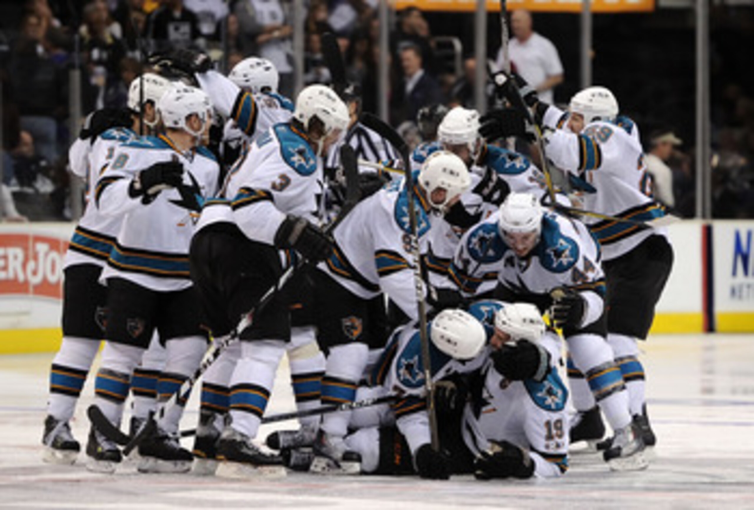 LOS ANGELES, CA - APRIL 25:  The San Jose Sharks celebrate after the game winning goal by Joe Thornton #19 against the Los Angeles Kings in game six of the Western Conference Quarterfinals to advance to the next round of the 2011 NHL Stanley Cup Playoffs 