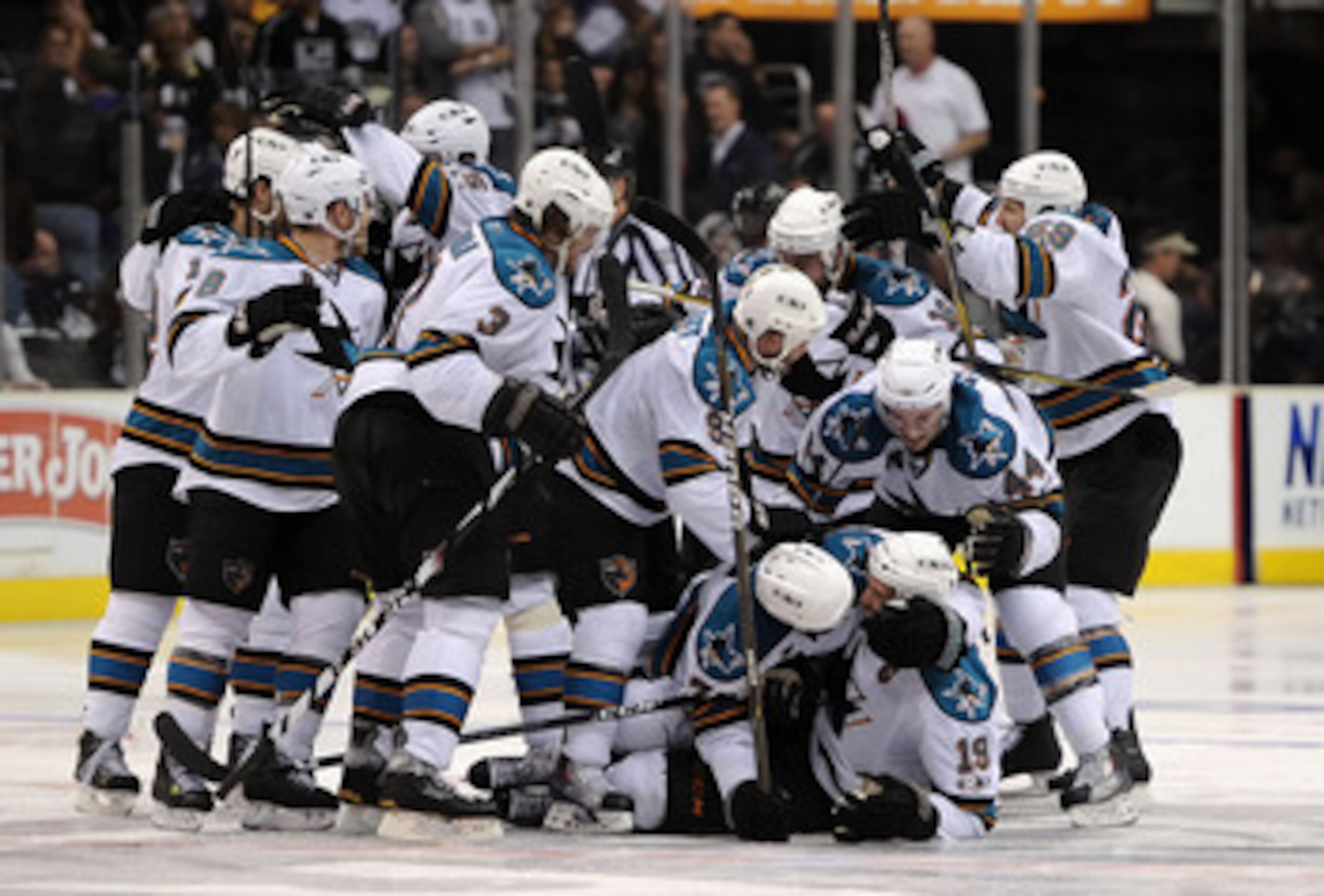 LOS ANGELES, CA - APRIL 25:  The San Jose Sharks celebrate after the game winning goal by Joe Thornton #19 against the Los Angeles Kings in game six of the Western Conference Quarterfinals to advance to the next round of the 2011 NHL Stanley Cup Playoffs 