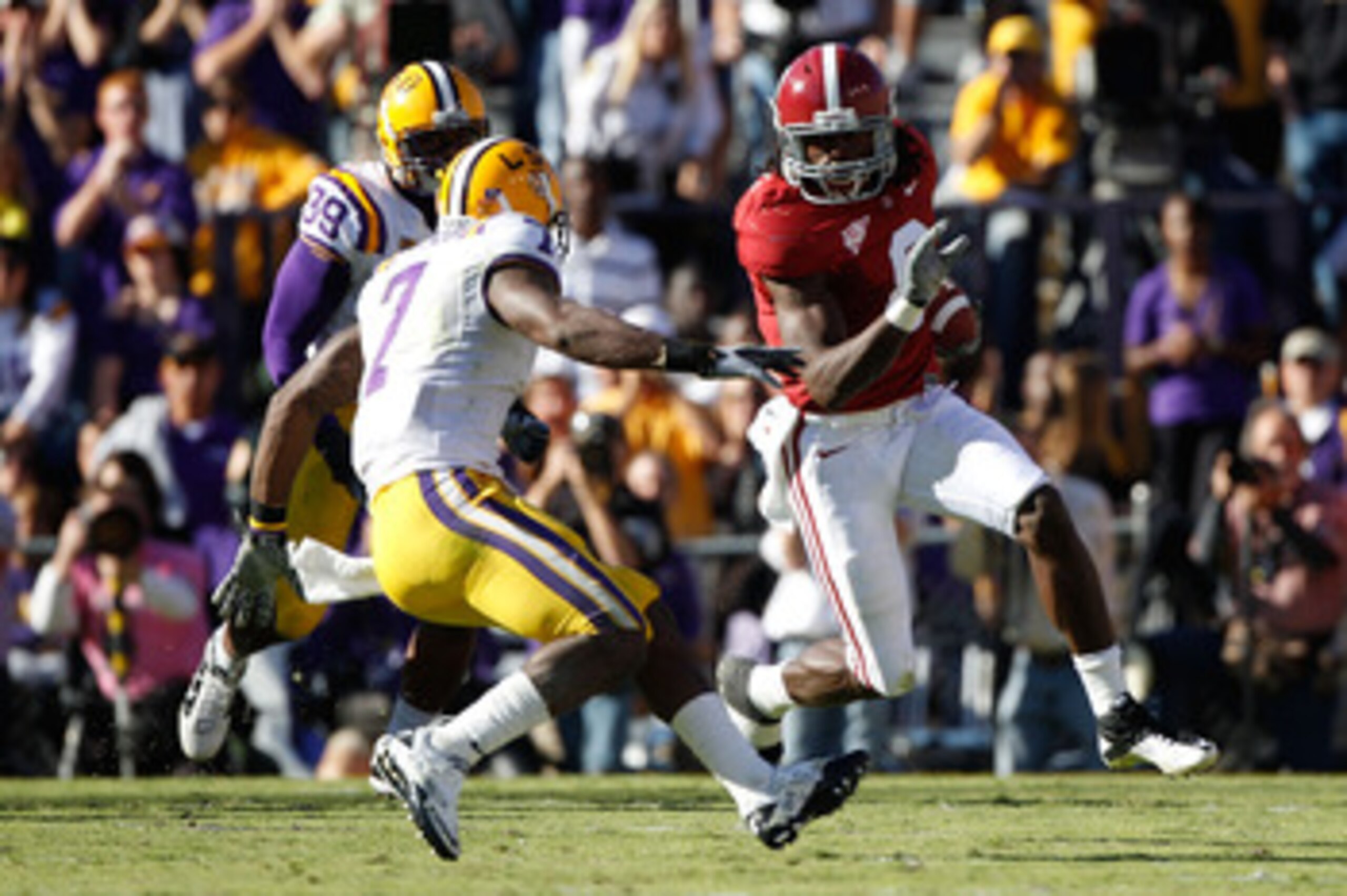 BATON ROUGE, LA - NOVEMBER 06: Julio Jones #8 of the Alabama Crimson Tide avoids a tackle by Patrick Peterson #7 of the Louisiana State University Tigers at Tiger Stadium on November 6, 2010 in Baton Rouge, Louisiana. The Tigers defeated the Crimson Tid BATON ROUGE, LA - NOVEMBER 06: Julio Jones #8 of the Alabama Crimson Tide avoids a tackle by Patrick Peterson #7 of the Louisiana State University Tigers at Tiger Stadium on November 6, 2010 in Baton Rouge, Louisiana. The Tigers defeated the Crimson Tid